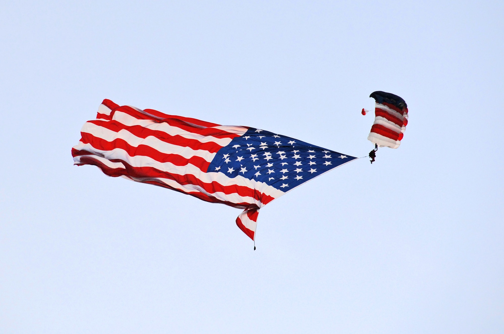 Paul McCowen of Cincinnati parachutes in the American Flag during opening ceremonies for the U.S. Air Force Marathon Sept. 19, 2009 at Wright-Patterson Air Force Base, Ohio. A record of nearly 10,000 runners participated. (Air Force photo/Ben Strasser)