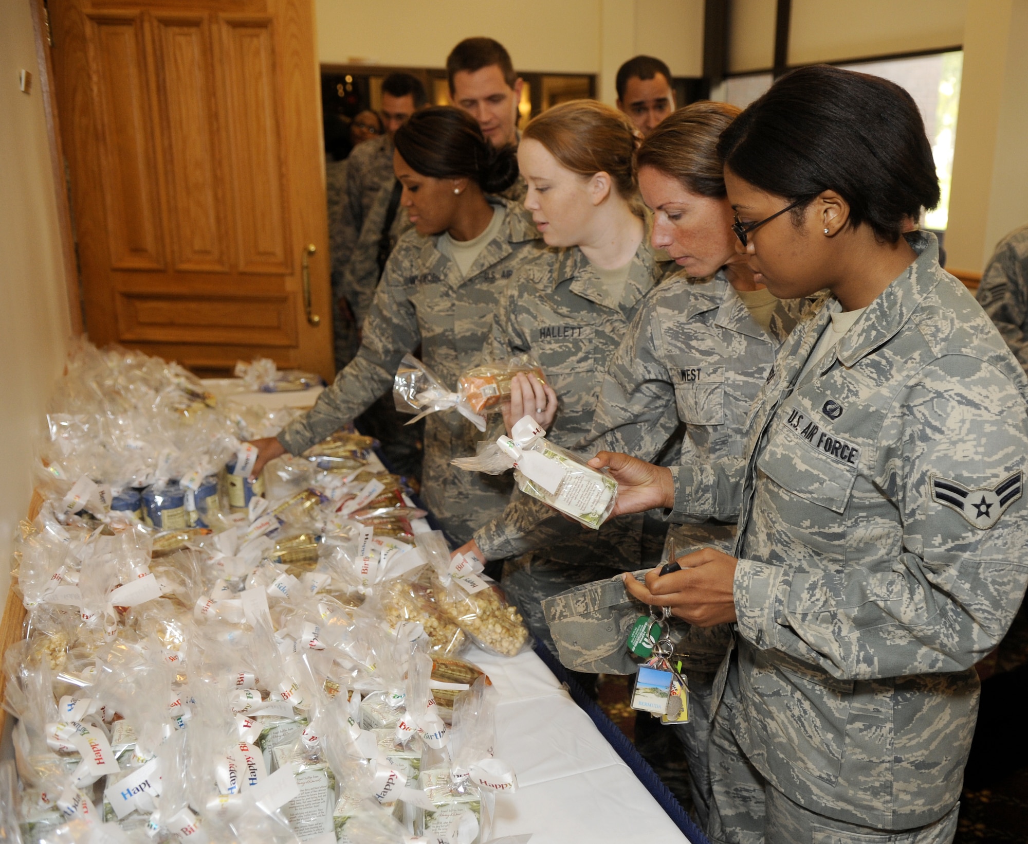 Airmen process through a queue lined with a variety of treats Sept. 18 at the Air Force Birthday luncheon held at the Community Center here. The luncheon marked the Air Force’s 62nd year as an independent branch of service. (U.S. Air Force photo/Carlos Cintron)