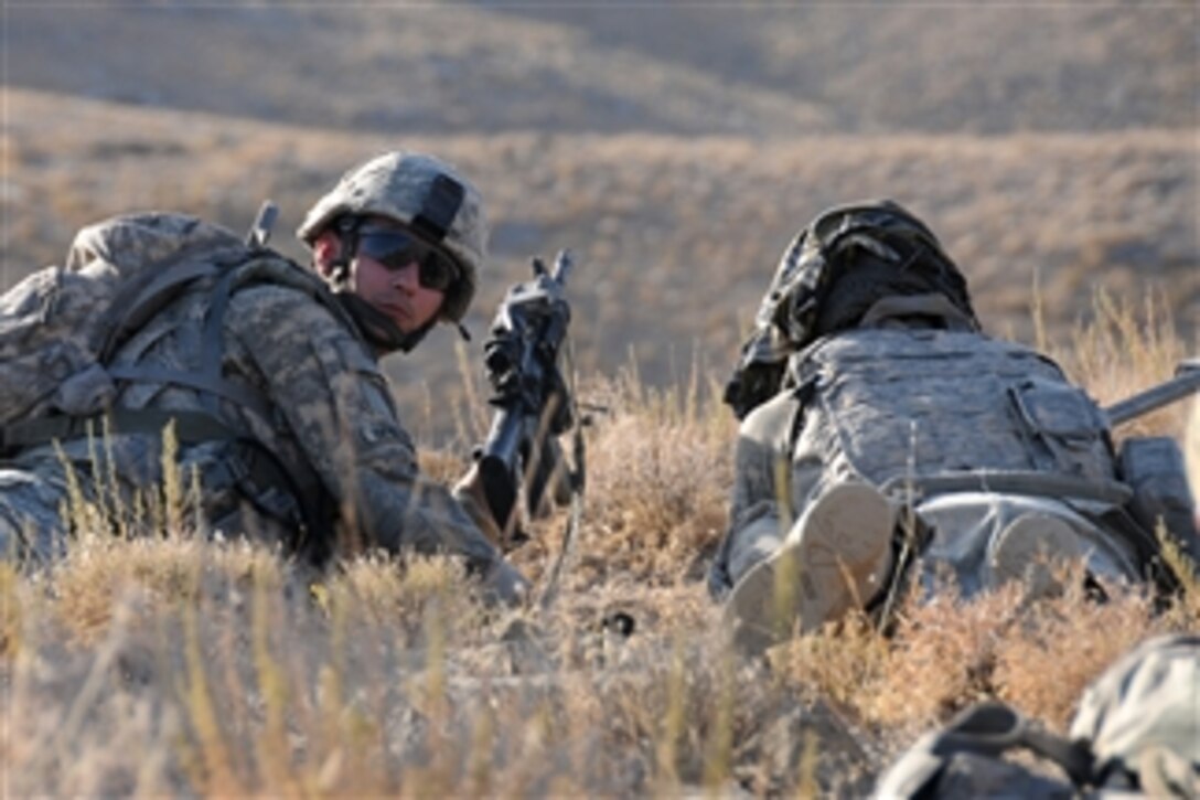 U.S. Army Pvt. Matthew Benzing and Pfc. Joshua Rouse (left) from Alpha Company, 1st Battalion, 4th Infantry Regiment, U.S. Army Europe conduct security over watch during a reconnaissance patrol near Forward Operating Base Mizan, in Zabul province, Afghanistan, on Sept. 12, 2009.  
