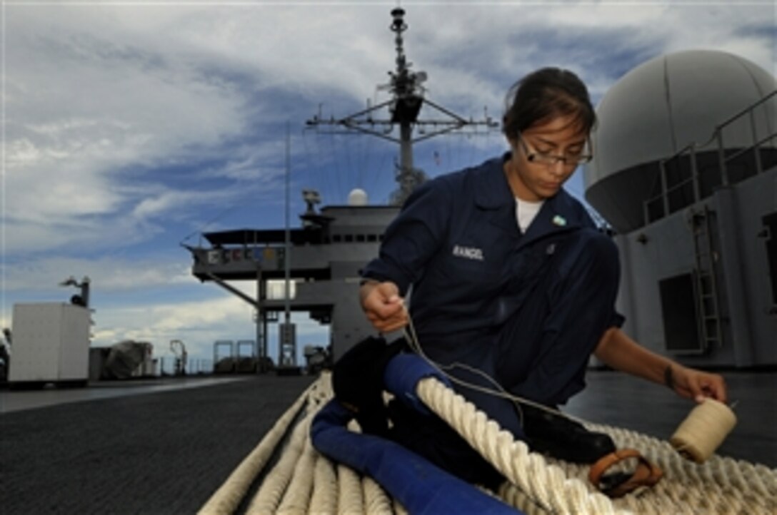 U.S. Navy Seaman Crystal Rangel stitches the sleeve of a Kevlar mooring line aboard the command ship USS Blue Ridge (LCC 19) underway in the Pacific Ocean on Sept. 11, 2009.  The ship serves under Commander, Expeditionary Strike Group 7/Task Force 76, the Navy's only forward-deployed amphibious force and is the flagship of Commander, U.S. 7th Fleet.  
