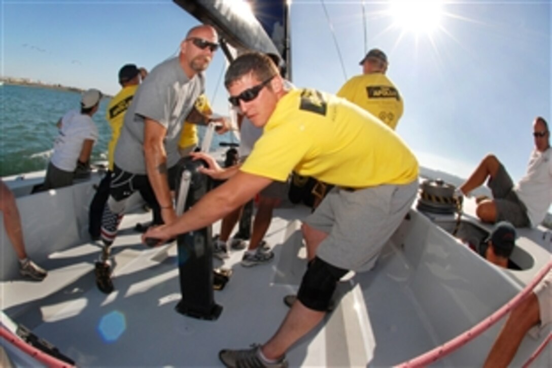 Stephen Bruggman, right, and Sam Jones, both wounded military veterans, maneuver their sailing boat during the Department of Veterans Affairs 2nd Annual Summer Sports Clinic in San Diego, Sept. 20, 2009. More than 65 veterans suffering disabilities ranging from post-traumatic stress to physical amputations are participating in the week-long event.