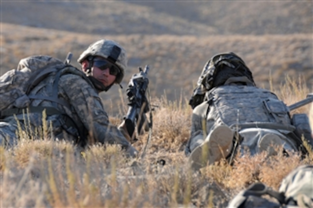 U.S. Army Pvt. Matthew Benzing and Pfc. Joshua Rouse (left) from Alpha Company, 1st Battalion, 4th Infantry Regiment, U.S. Army Europe conduct security over watch during a reconnaissance patrol near Forward Operating Base Mizan, in Zabul province, Afghanistan, on Sept. 12, 2009.  