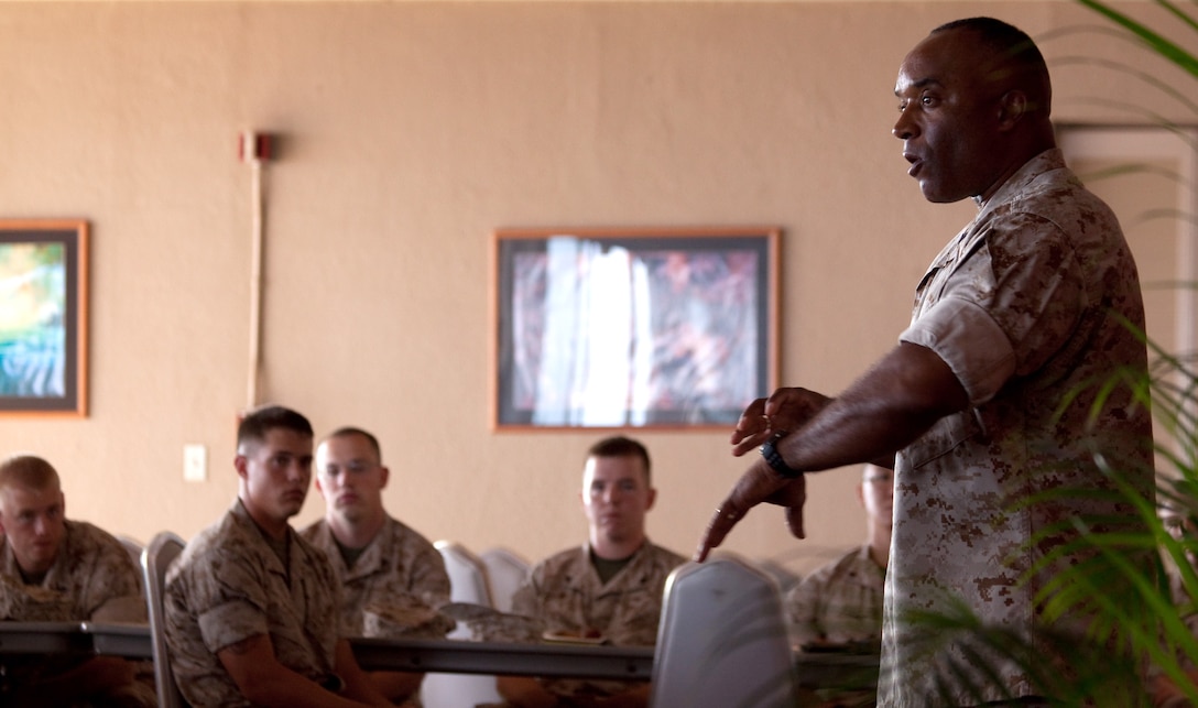 CAMP H.M. SMITH, Hawaii - Sgt. Maj. James Futrell, sergeant major, U.S. Marine Corps Forces Pacific, speaks to Headquarters Battalion Marines Sept. 25, at the Sunset Lanai. Futrell held a PME focusing on the Marine Corps and various aspects before offering Marines a chance to ask questions. (U.S. Marine Corps photo by Cpl. Achilles Tsantarliotis)(Released)