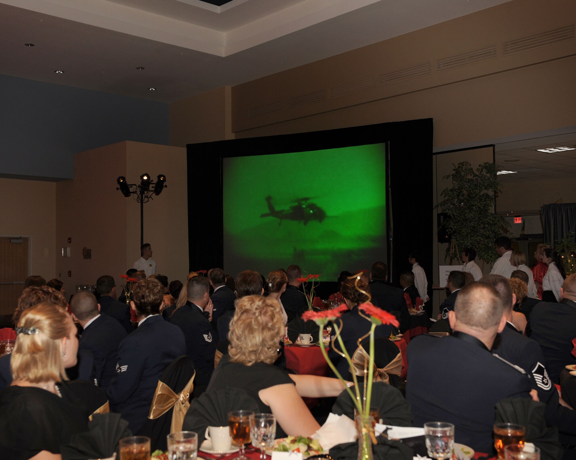 During the 62nd Air Force birthday celebration, many people from the Desert Lightning community gathered to reflect on today’s mission by watching video clips of recently deployed Davis-Monthan military members. Video footage was produced by the 355th Fighter Wing Public Affairs office. The ball was held at the University of Arizona in the Grand Ballroom Sept. 19, 2009. (U.S. Air Force Photo/Staff Sgt. Valerie Smith)