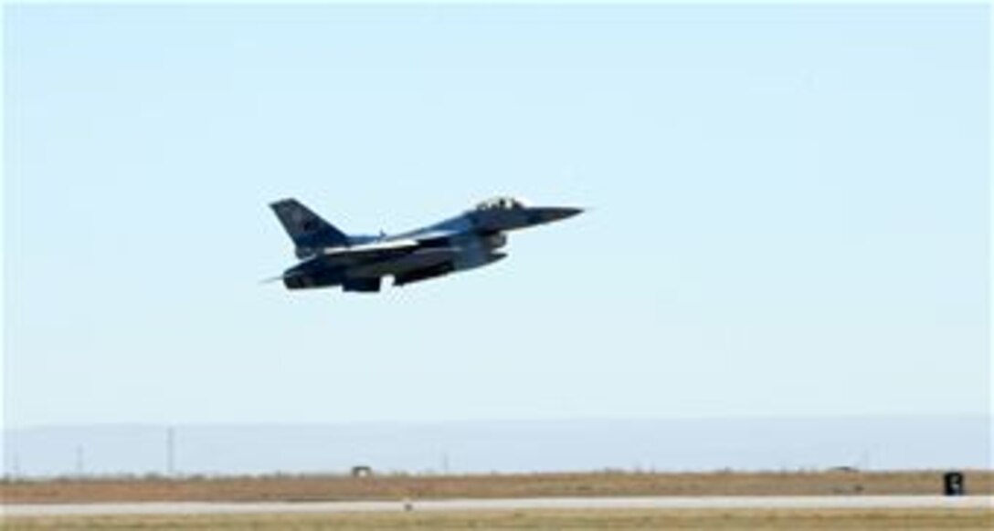 An F-16 Fighting Falcon from the 64th Aggressor Squadron at Nellis Air Force Base, Nev., takes off Sept. 24, 2009, from Mountain Home AFB, Nev., during Gunfighter Flag.  With a mission to know, teach and replicate any threat friendly forces may face, pilots from the 64th AGS represented enemy aircrews as ?red air force? participants during the exercise.  Gunfighter Flag, which ran from Sept. 14 through 24, was Mountain Home?s first large-scale, multi-national exercise which brought more than 450 personnel from the U.S. Air Force, U.S. Navy and Canadian air force to the base.  (U.S. Air Force photo/Airman 1st Class Debbie Lockhart)