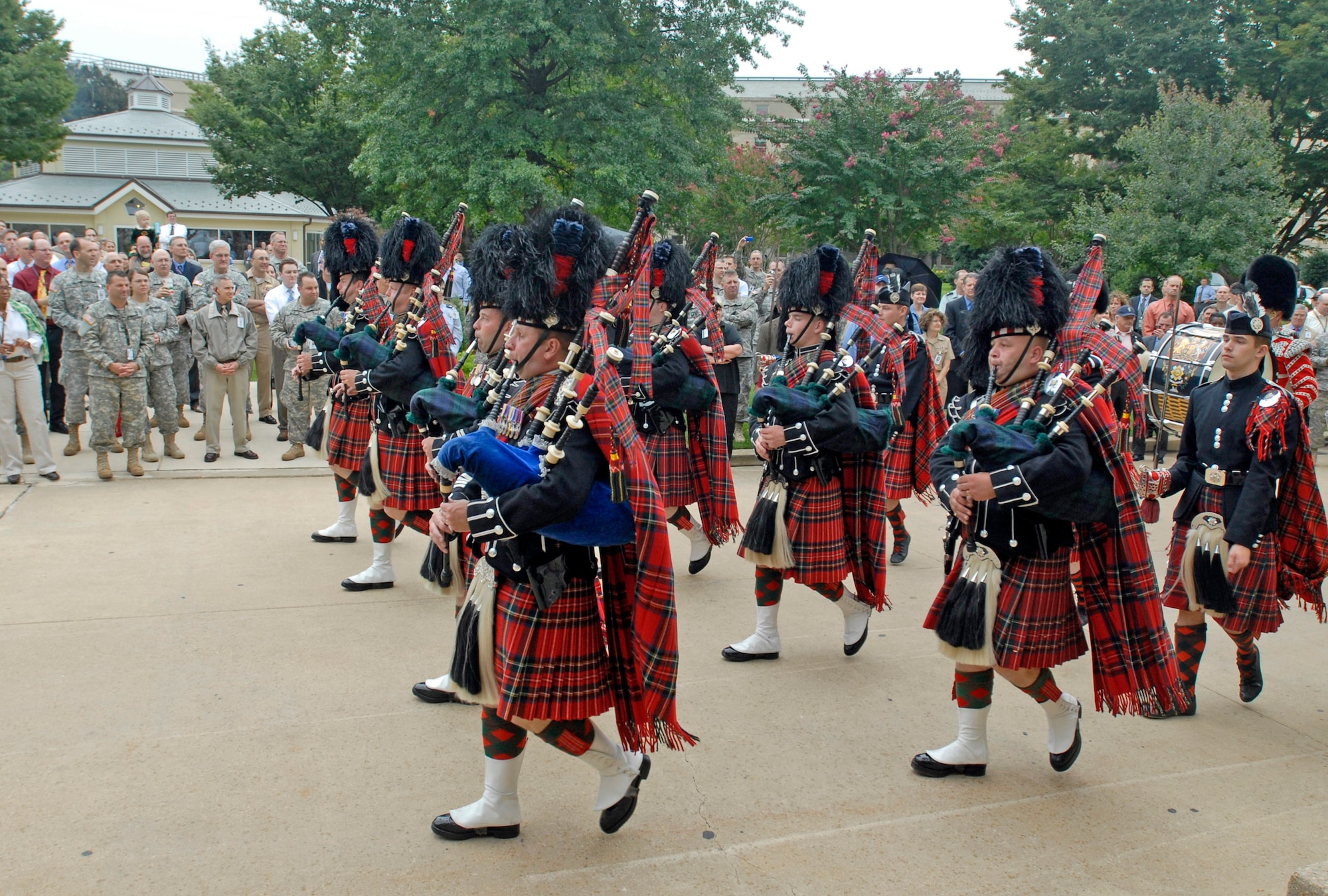 The British Army Pipes and Drums of the 1st Battalion Scots Guard performs for employees, servicemembers and families Sept. 25, 2009, at the Pentagon. The band that consists of infantry soldiers performed for its closet allies prior to a Helmand Province deployment next spring. (U.S. Air Force photo/Master Sgt. Stan Parker) 