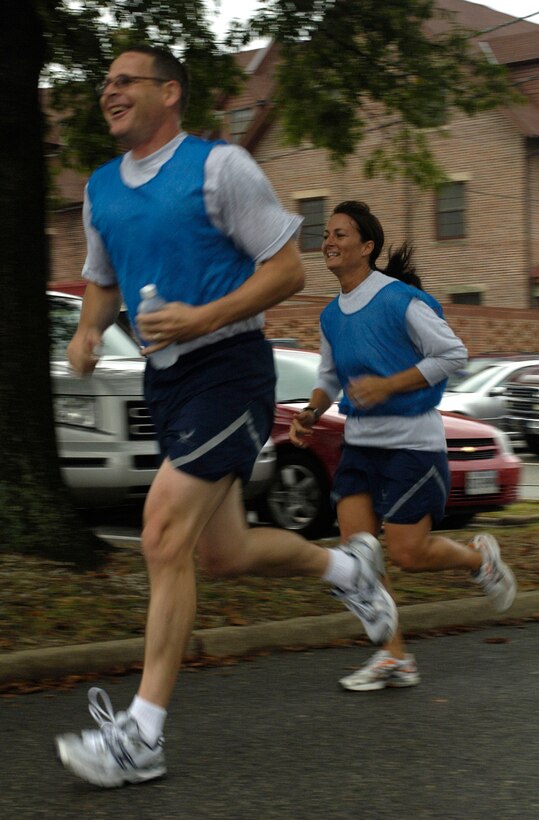 LANGLEY AIR FORCE BASE, Va. –Chief Master Sgt. Kevin Slater, 1st Fighter Wing command chief, and Tech. Sgt. Rachel Staub, 1st FW, participate in a triathlon here Sept. 25. Approximately 21 teams signed up to battle it out during a 10K cycle, 5K run and 1.2K row. (U.S. Air Force Photo/Staff Sgt Christina M. Styer)