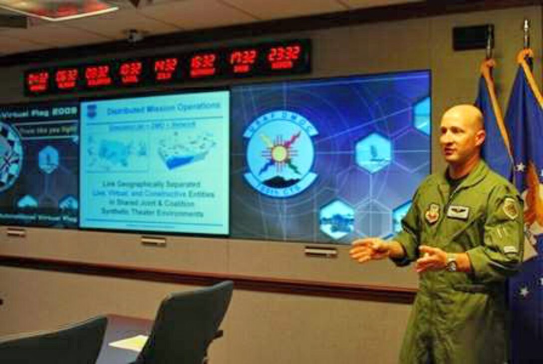 Lt. Col. Dan Pepper briefs observers at the end of Coalition Virtual Flag 09-4 Sept. 23, 2009, at the Pentagon. The multinational virtual training exercise involved Australia, Canada and England. The countries were among some 215 military members, civil servants and contractors across 25 worldwide locations who participated in the integrated training. Colonel Pepper is the 705th Combat Training Squadron director of operations at Kirtland Air Force Base, N.M. (U.S. Air Force photo/Tech. Sgt. Amaani Lyle) 