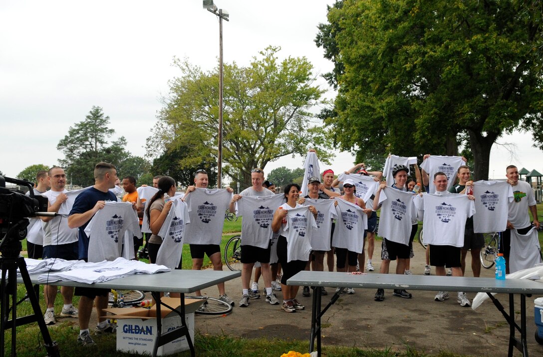 LANGLEY AIR FORCE BASE, Va. -- Members of Team Langley celebrate after completing a triathlon here Sept. 25. Approximately 21 teams signed up to battle it out in the 10K cycle, 5K run and 1.2K row. (U.S. Air Force Photo/Senior Airman Dana Hill)