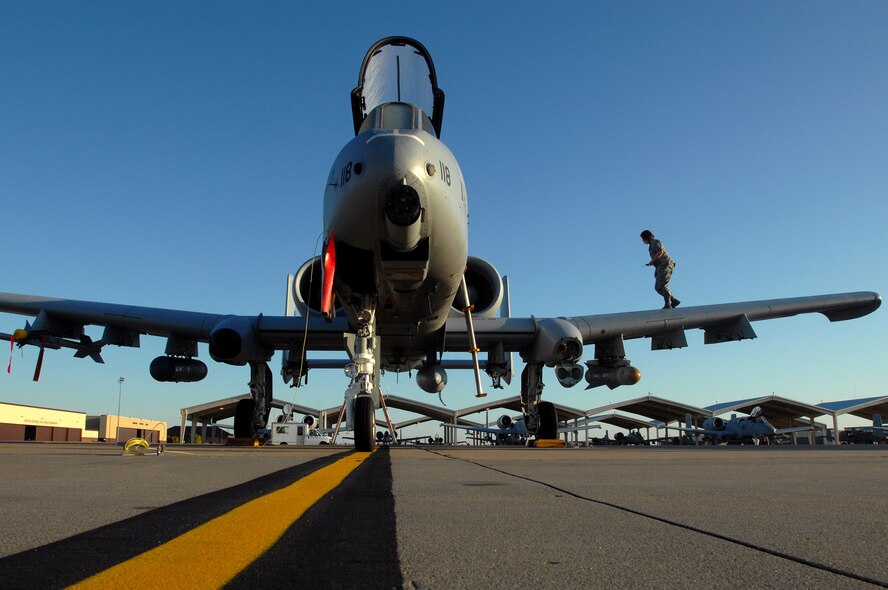 WHITEMAN AIR FORCE BASE, Mo. - Airman Jill Hallandsworth, 442nd Fighter Wing crew chief, performs a pre-flight inspection on an A-10 Thunderbolt II prior to take off, Sept. 25. Crew chiefs with the 442nd FW maintain a vast fleet of 27 A-10 Aircraft keeping each jet prepared for any mission at a moment's notice. (U.S. Air Force photo/Senior Airman Kenny Holston) 