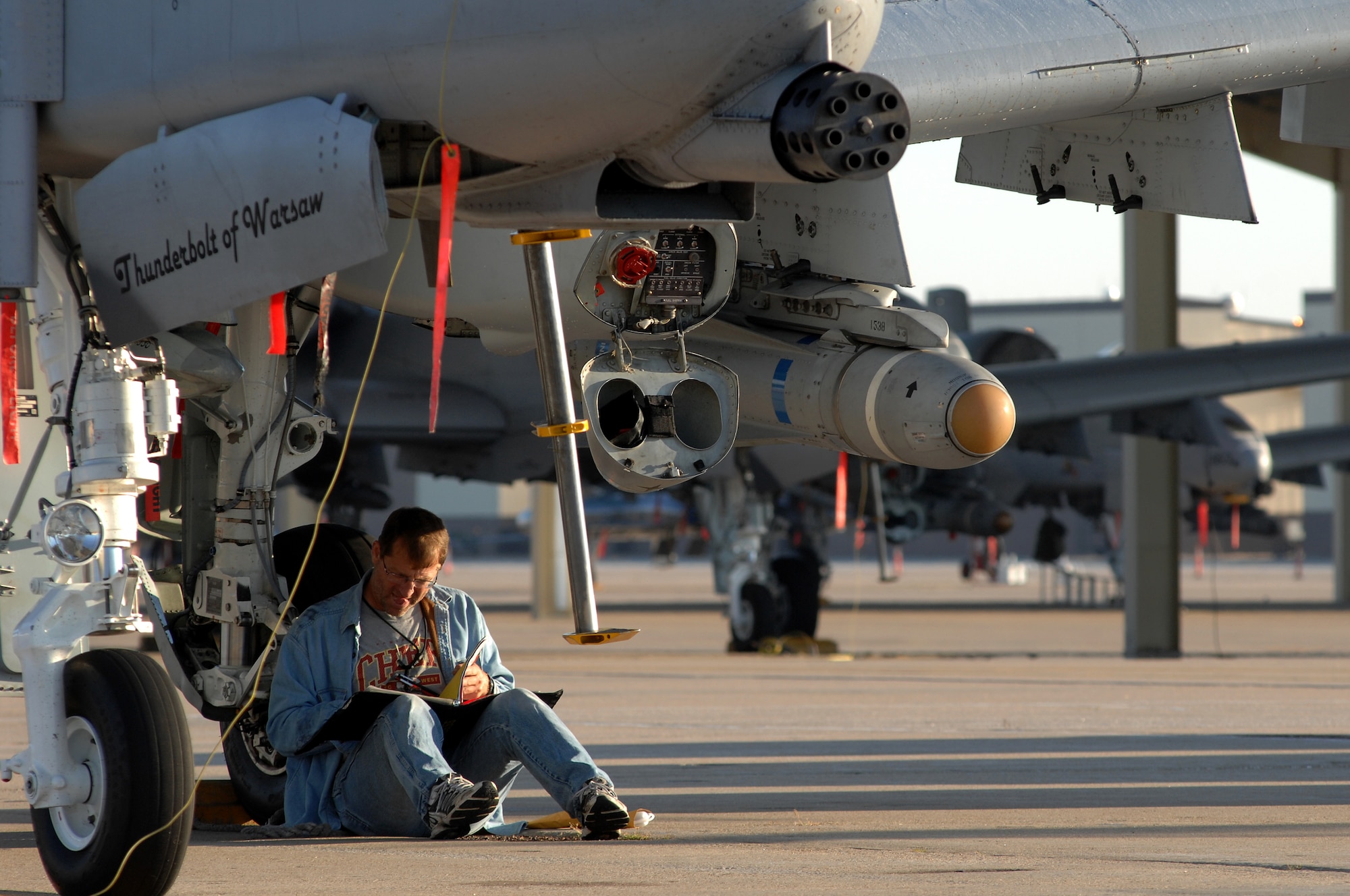 WHITEMAN AIR FORCE BASE, Mo. - Duston Ross, 442nd Fighter Wing crew chief, goes over a pre flight checklist after performing an inspection on an A-10 Thunderbolt II prior to take off, Sept. 25. Crew chiefs with the 442nd FW maintain a vast fleet of 27 A-10 aircraft keeping each jet prepared for any mission at a moment's notice. (U.S. Air Force photo/Senior Airman Kenny Holston)  