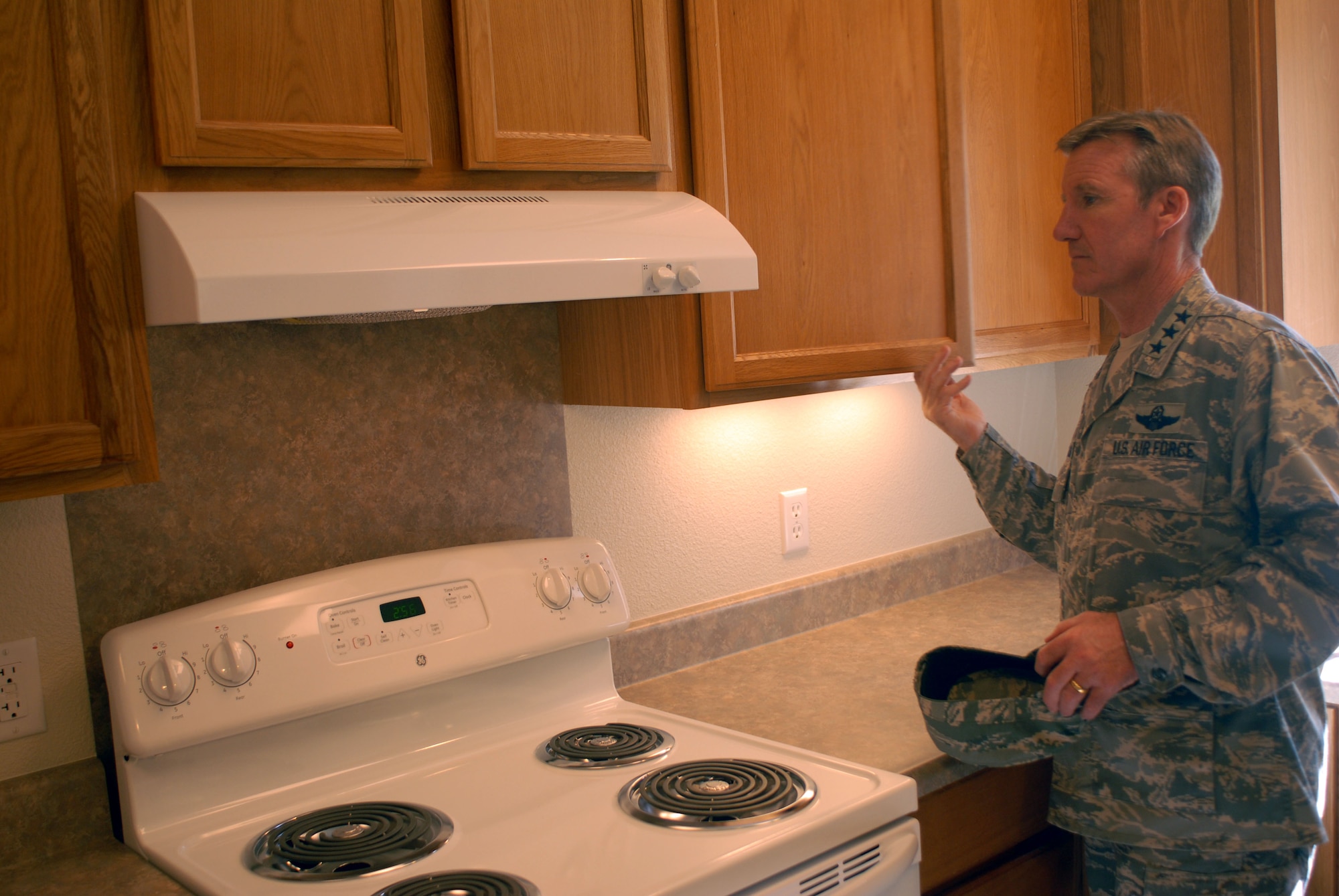 HICKAM AIR FORCE BASE, Hawaii -- Lt. Gen. "Hawk" Carlisle, 13th Air Force commander, walks through a home on base during his tour of the 15th Airlift Wing here, Sept. 24. General Carlisle assumed command of the 13th Air Force on Sept. 2. (U.S. Air Force photo/Senior Airman Gustavo Gonzalez)