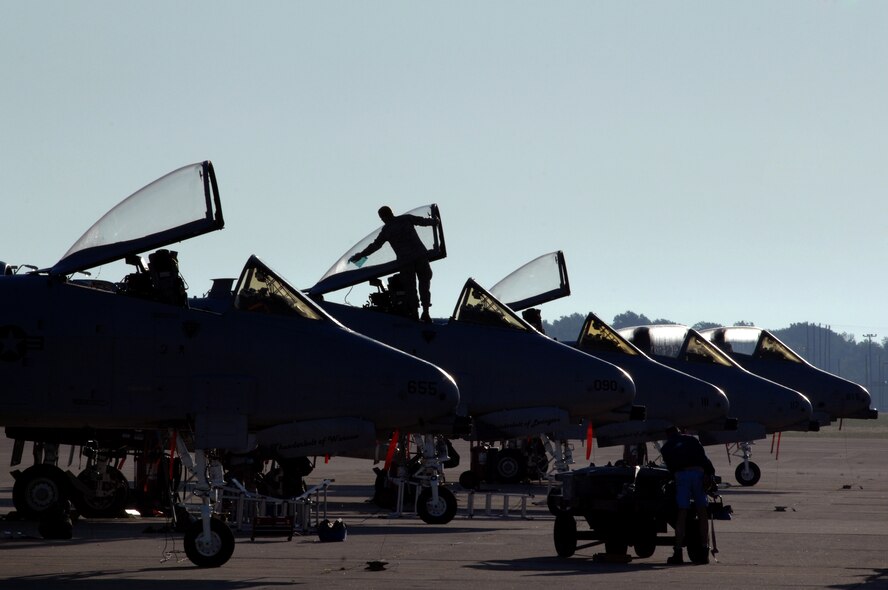 WHITEMAN AIR FORCE BASE, Mo. - Master Sgt. William Porterfield, 442nd Fighter Wing crew chief, wipes the morning dew from the cockpit of an A-10 Thunderbolt II before inspecting the aircraft for takeoff, Sept. 25. Crew chiefs with the 442nd FW maintain a vast fleet of 27 A-10 aircraft keeping each jet prepared for any mission at a moment's notice. (U.S. Air Force photo/Senior Airman Kenny Holston)  