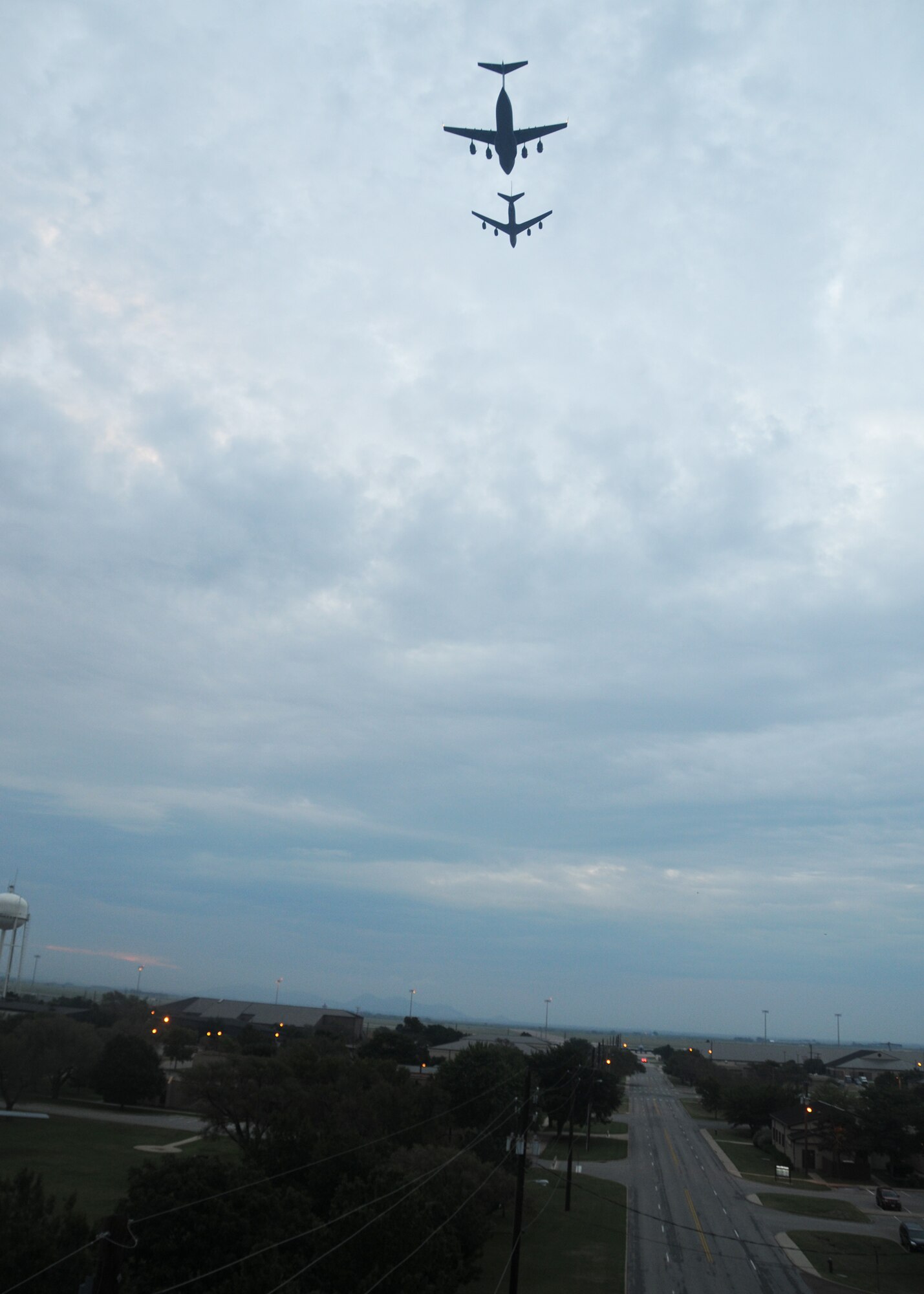 ALTUS AIR FORCE BASE, Okla. –  A KC-135 Stratotanker and a C-17 Globemaster III perform a flyover for the POW/MIA Ceremony at the Wings of Freedom Park Sept. 18. (U.S. Air Force photo by Airman 1st Class Tiffany M. Deuel)