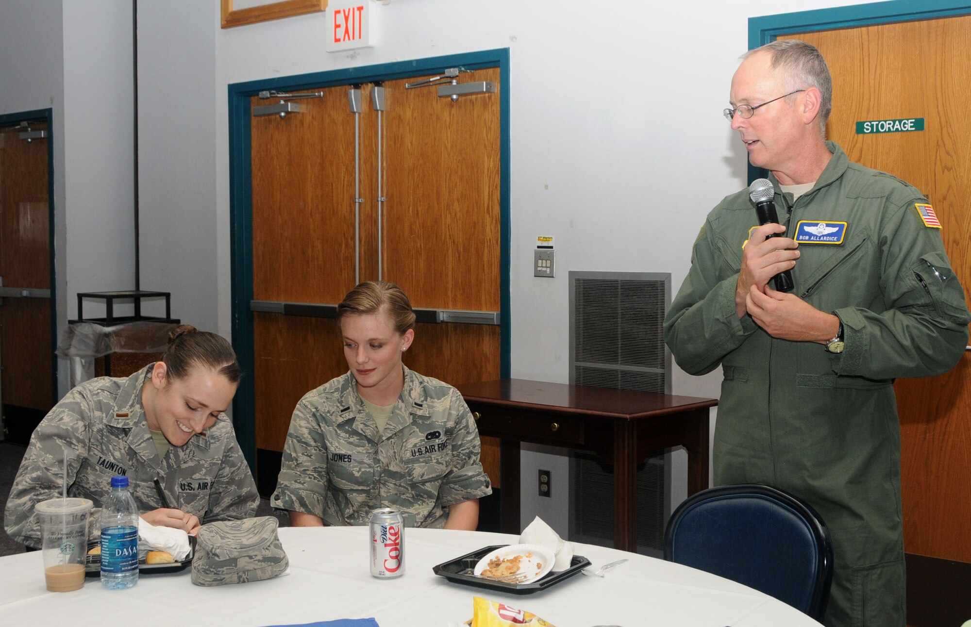 ALTUS AIR FORCE BASE, Okla.-- Lt. Gen. Robert Allardice, 18th Air Force commander, answers a question from 2nd Lt. Sybil Taunton, 97th Air Mobility Wing, during an Airlift/Tanker Association luncheon Sept. 18. Lieutenant Taunton took notes as Lt. General Allardice described what it takes to be a good leader as a young officer.  (U.S. Air Force photo/Senior Airman Cherice Bryant)