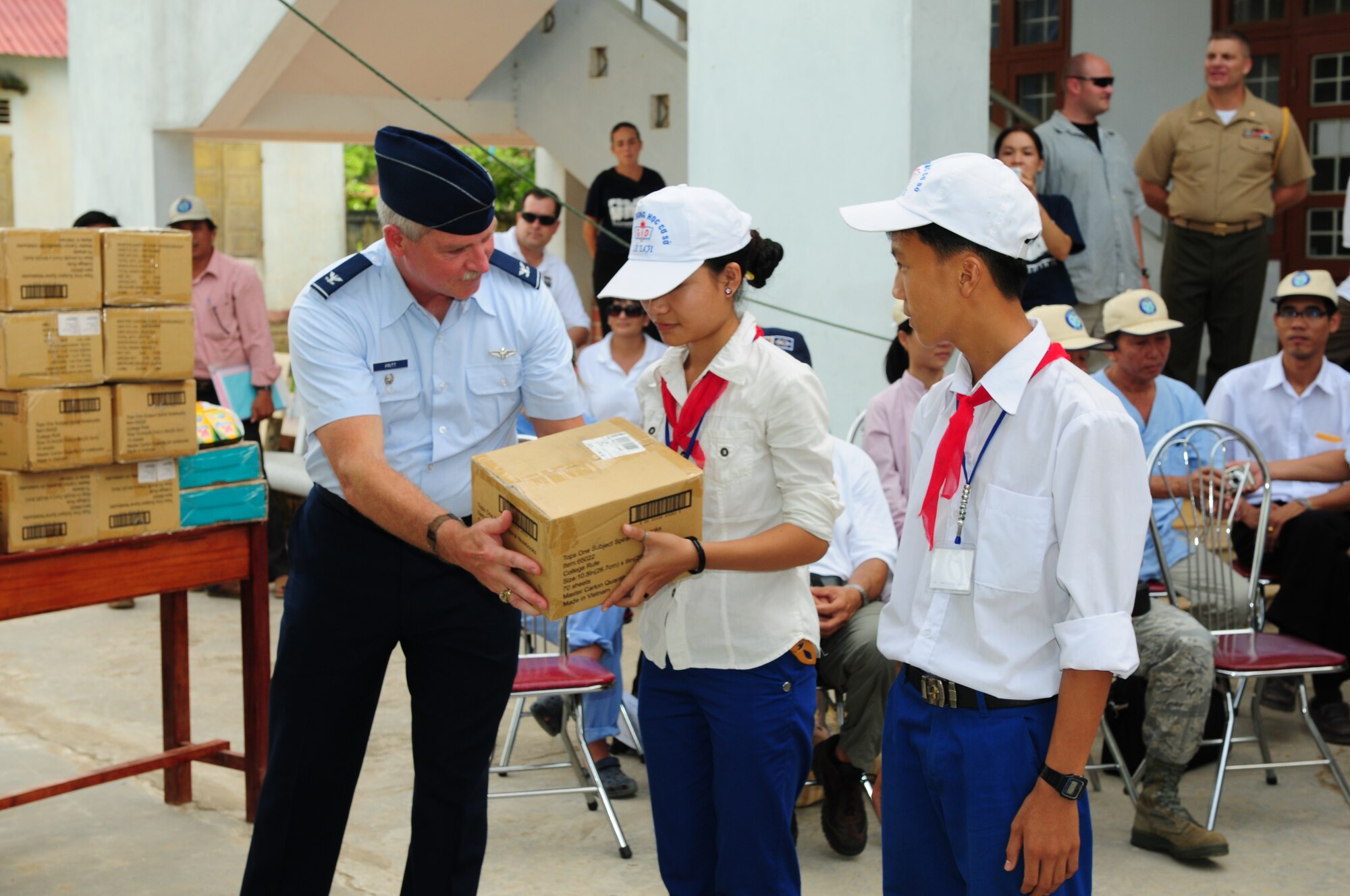 Col. Wayne Pritt, 13th Air Force command surgeon at Hickam Air Force Base, Hawaii, presents donated schools supplies and toys to children in Quang Tri Province, Vietnam, Sept. 22.  The donations were presented as part of Operation Pacific Angel 2009.  Airmen were in Vietnam Sept. 15 to 24 to provide humanitarian assistance in cooperation with local authorities to area residents. Pacific Angel is a Pacific Air Forces operation led by 13th Air Force at Hickam AFB.  (U.S. Air Force photo/Tech. Sgt. Kerry Jackson)