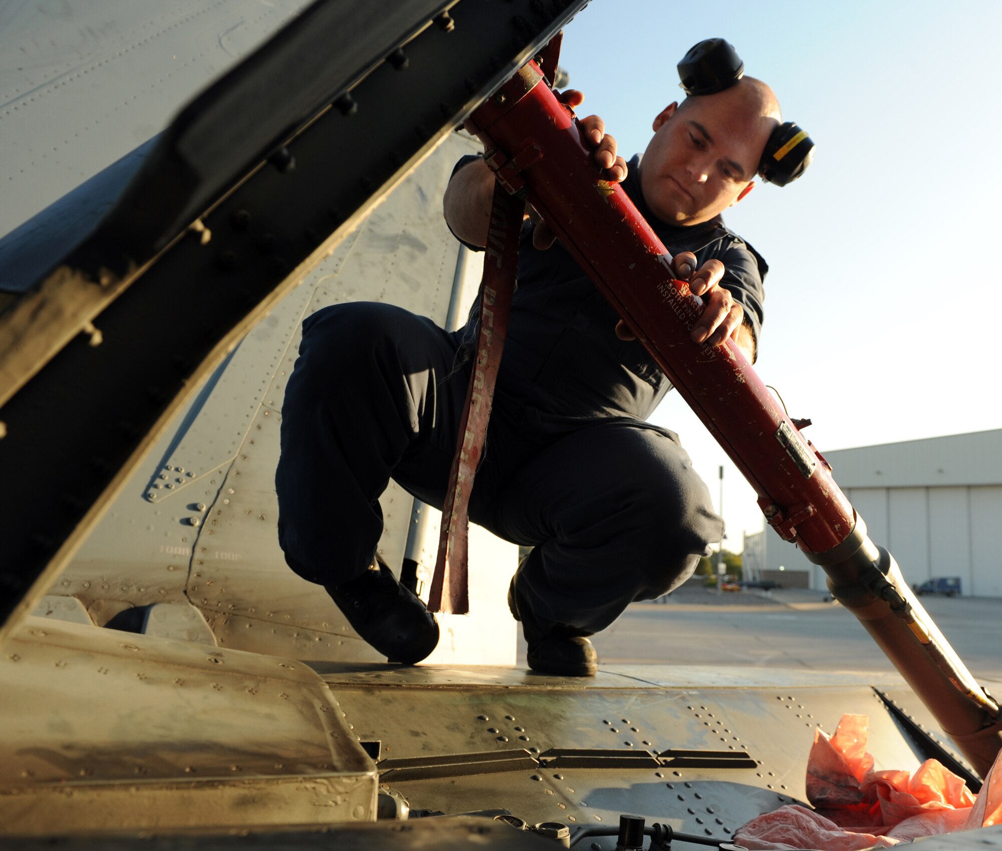 MOUNTAIN HOME AIR FORCE BASE, Idaho -- Cpl. Kevin Beauregard, 409th Tactical Fighter Squadron weapons systems technician, fixes a brake panel on a CF-18 Hornet Sept. 25. The CF-18 Hornets from the 409th TFS out of Cold Lake, Alberta, Canada, participated as friendly "blue air" forces during the exercise. Gunfighter Flag, which ran from Sept. 14 through 24, was Mountain Home's first ever large-scale, multi-national exercise which brought more than 450 personnel from the U.S. Air Force, U.S. Navy and Canadian air force to Mountain Home. (U.S. Air Force photo by Airman 1st Class Debbie Lockhart)