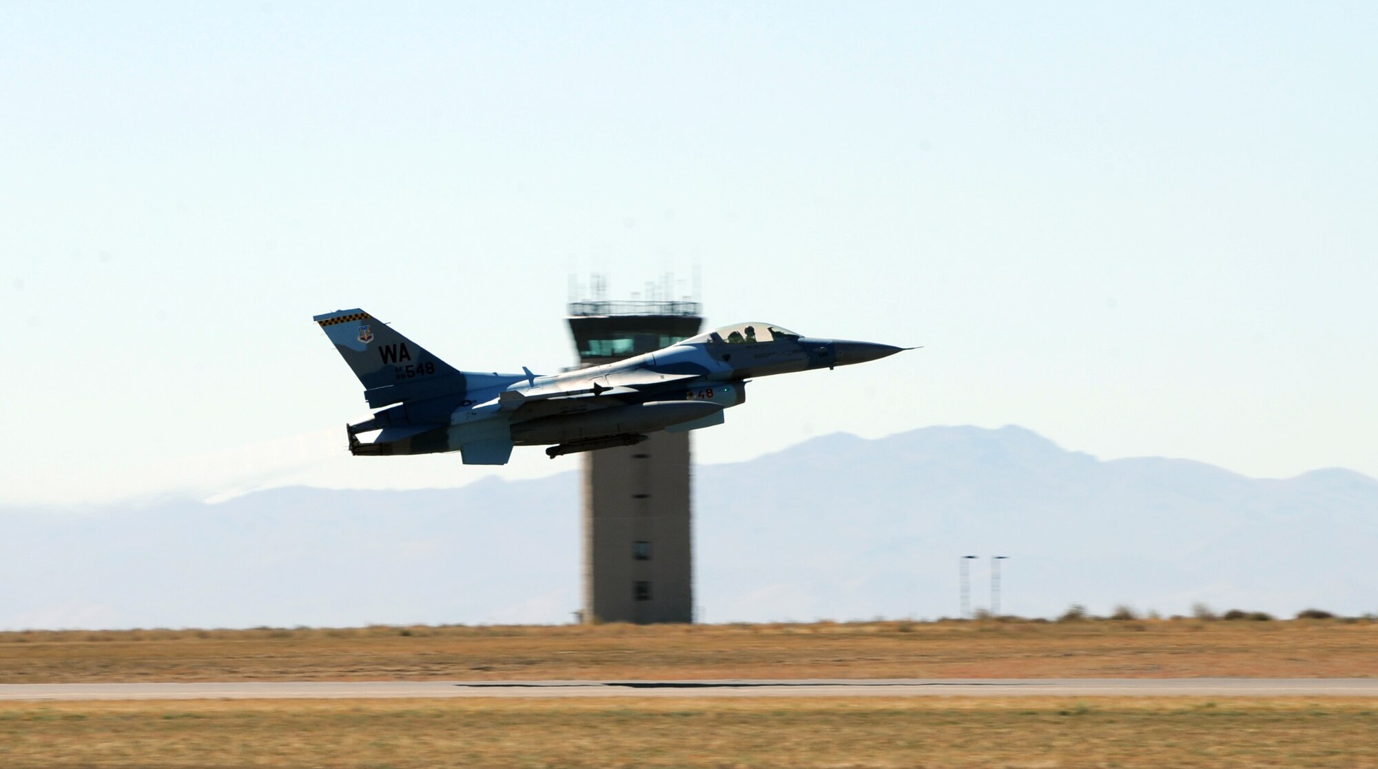 MOUNTAIN HOME AIR FORCE BASE, Idaho -- An F-16 Fighting Falcon from the 64th Aggressor Squadron takes off Sept. 24 during Gunfighter Flag. With a mission to know, teach and replicate any threat friendly forces may face, the 64th AGS and their F-16 Fighting Falcons from Nellis AFB, Nev., represented enemy aircrews as "red air" participants during the exercise. Gunfighter Flag, which ran from Sept. 14 through 24, was Mountain Home's first ever large-scale, multi-national exercise which brought more than 450 personnel from the U.S. Air Force, U.S. Navy and Canadian air force to Mountain Home. (U.S. Air Force photo by Airman 1st Class Debbie Lockhart)