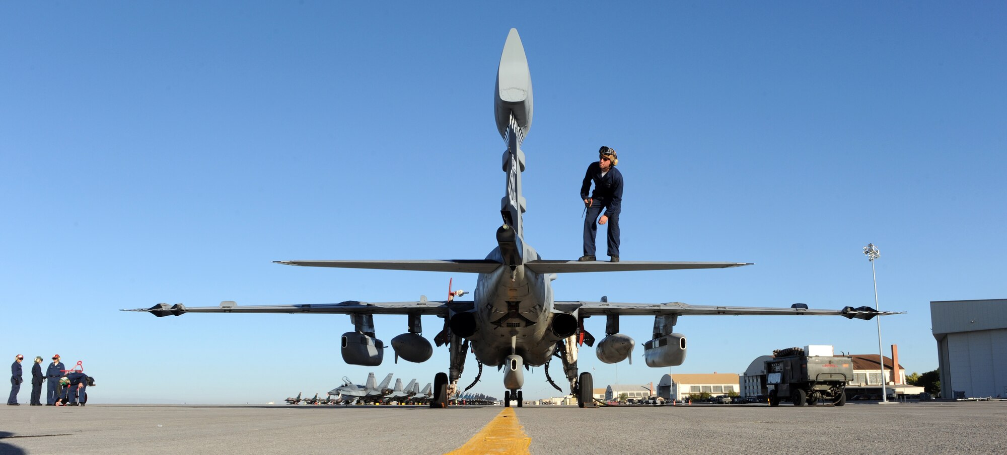 MOUNTAIN HOME AIR FORCE BASE, Idaho -- Seaman Apprentice Adan Michels, Tactical Electron Attack Squadron 137 plane captain, looks over the tail of an EA-6B Prowler as part of a pre-flight inspection Sept. 24 during Gunfighter Flag. The EA-6B Prowlers from the VAQ-137 out of Whidbey Island NAS, Wash., participated as friendly "blue air" forces during the exercise. Gunfighter Flag, which ran from Sept. 14 through 24, was Mountain Home's first ever large-scale, multi-national exercise which brought more than 450 personnel from the U.S. Air Force, U.S. Navy and Canadian air force to Mountain Home. (U.S. Air Force photo by Airman 1st Class Debbie Lockhart)