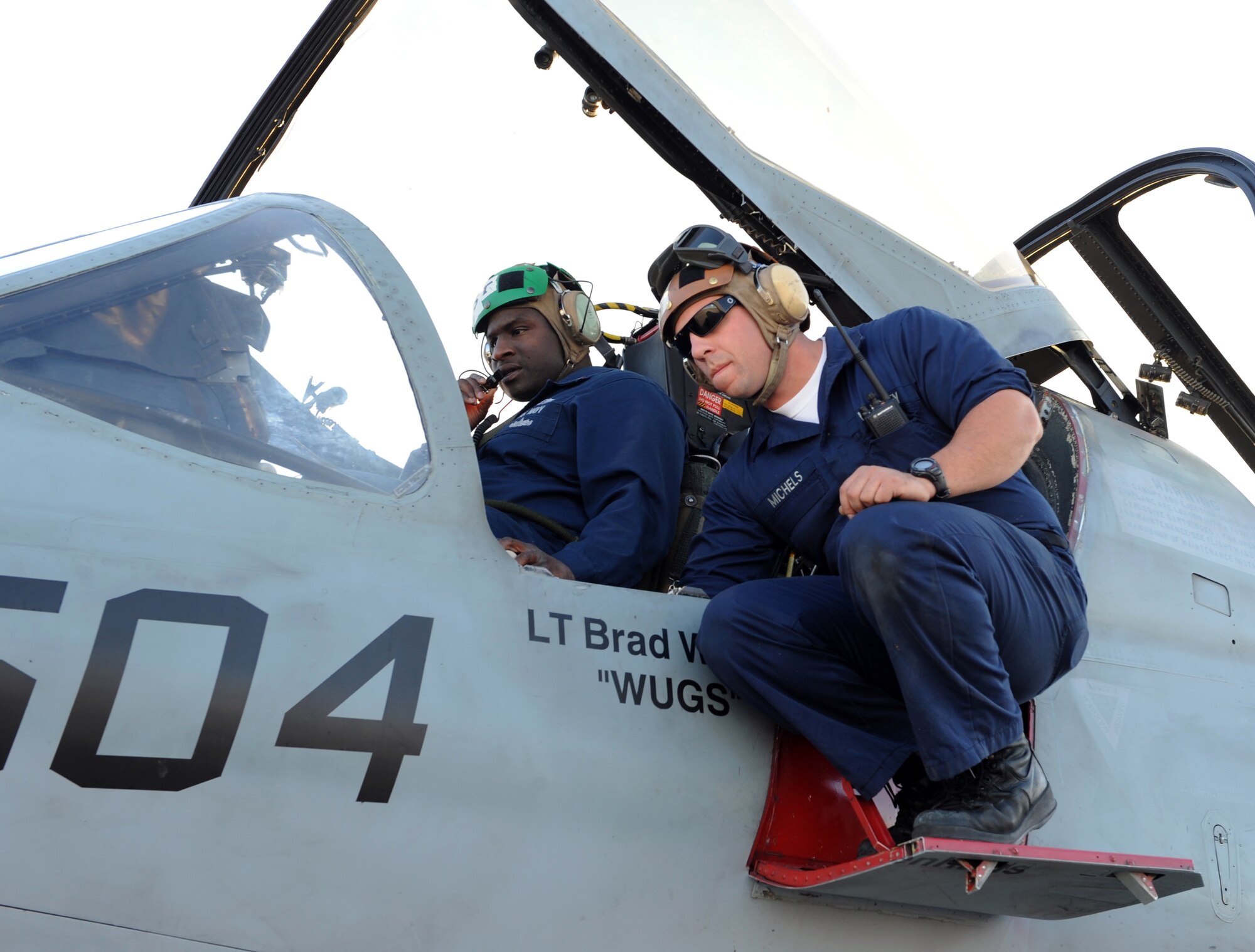 MOUNTAIN HOME AIR FORCE BASE, Idaho -- Left, Petty Officer 2nd Class Willie Cochran, Tactical Electronic Attack Squadron 137 avionics technician, and Seaman Apprentice Adan Michels, VAQ-137 plane captain, perform a pre-flight inspection of an EA-6B Prowler Sept. 24 during Gunfighter Flag. The EA-6B Prowlers from the VAQ-137 out of Whidbey Island NAS, Wash., participated as friendly "blue air" forces during the exercise. Gunfighter Flag, which ran from Sept. 14 through 24, was Mountain Home's first ever large-scale, multi-national exercise which brought more than 450 personnel from the U.S. Air Force, U.S. Navy and Canadian air force to Mountain Home. (U.S. Air Force photo by Airman 1st Class Debbie Lockhart)