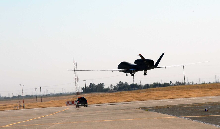 An RQ-4 Global Hawk lands at Beale Sept. 22, 2009 after completing a routine training mission in the local area. The RQ-4 Global Hawk is a high-altitude, long-endurance unmanned aircraft system with an integrated sensor suite that provides intelligence, surveillance and reconnaissance (ISR) capabilities worldwide. (U.S. Air Force Photo/ Tech. Sgt. Luke Johnson)