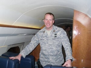 CAMP ARIFJAN, Kuwait -- Maj. Kurt E. Muller, Air Combat Command A7, stands aboard a C-20 aircraft. Major Muller is currently deployed to Kuwait, serving as the Afghanistan civil engineering action officer for Army Central Command. (Photo courtesy/Maj. Kurt E. Muller)