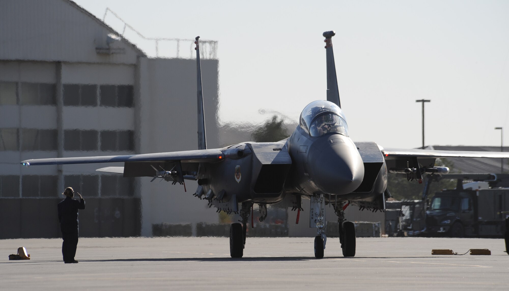 MOUNTAIN HOME AIR FORCE BASE, Idaho -- Staff Sgt. Alisha Welch, 366th Aircraft Maintenance Squadron crew chief, renders a salute as an F-15E Strike Eagle from the 391st Fighter Squadron taxis down the flightline Sept. 22 during Gunfighter Flag. The exercise, which ran from Sept. 14 through 24, was Mountain Home’s first ever large-scale, multi-national exercise which brought more than 450 personnel from the U.S. Air Force, U.S. Navy and Canadian air force to Mountain Home. (U.S. Air Force photo by Airman 1st Class Renishia Richardson) 