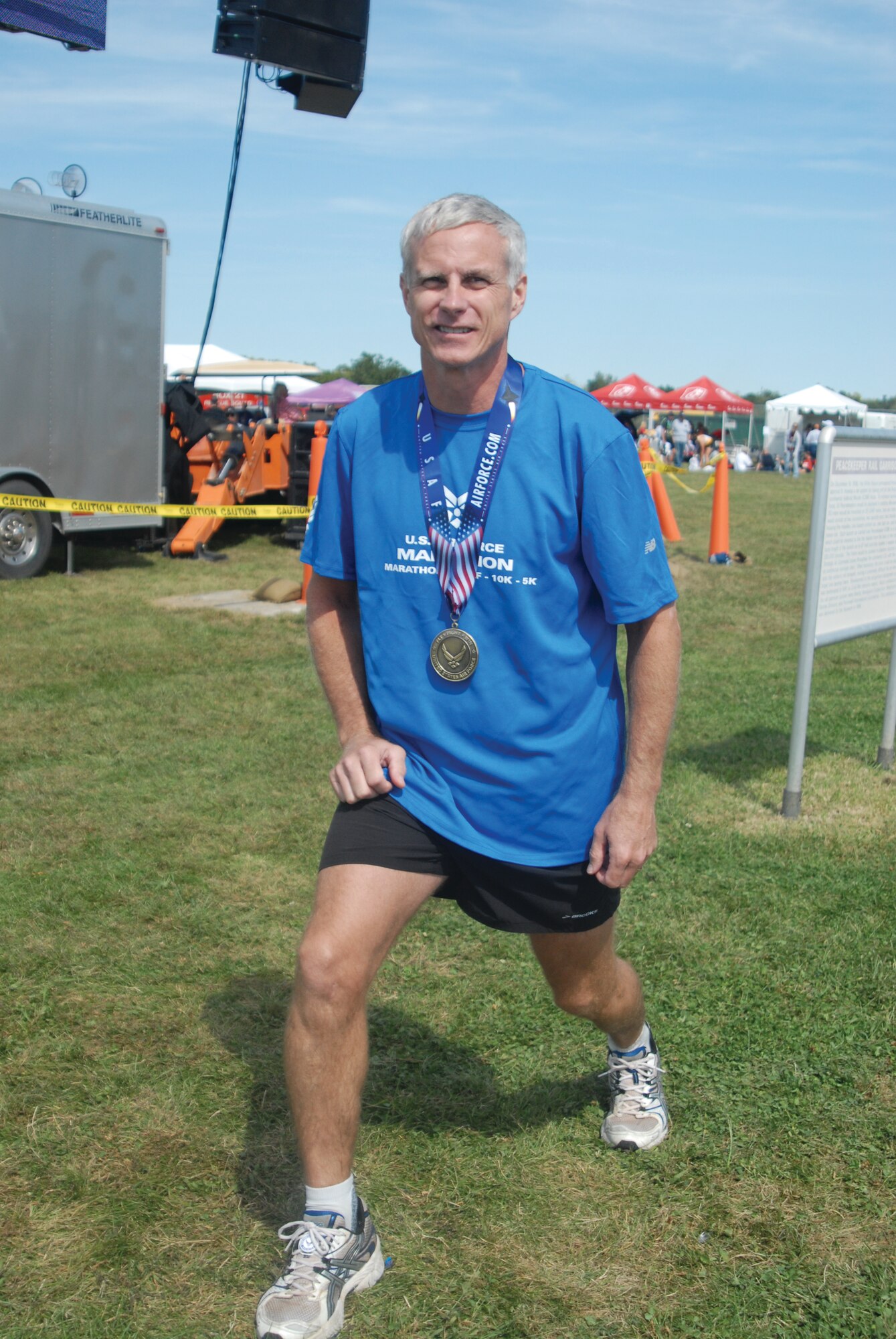 Col. Mike Buck, Det. 847, ROTC, Angelo State University commander, stretches after completing the full marathon, Sept. 19, at Wright-Patterson AFB. (U.S. Air Force photos by Airman 1st Class Anne Gathua)
