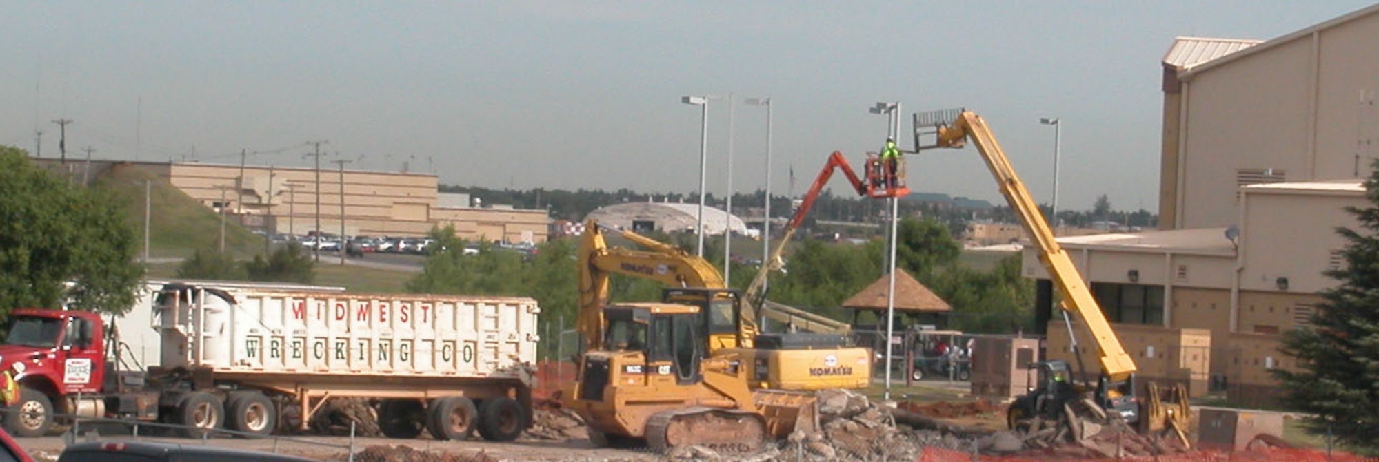 Demolition crews got busy this week tearing down buildings 1041 and 1037 to prepare a site for construction of the new maintenance hangar.  The buildings formerly housed maintenance functions which have been moved to other locations. 