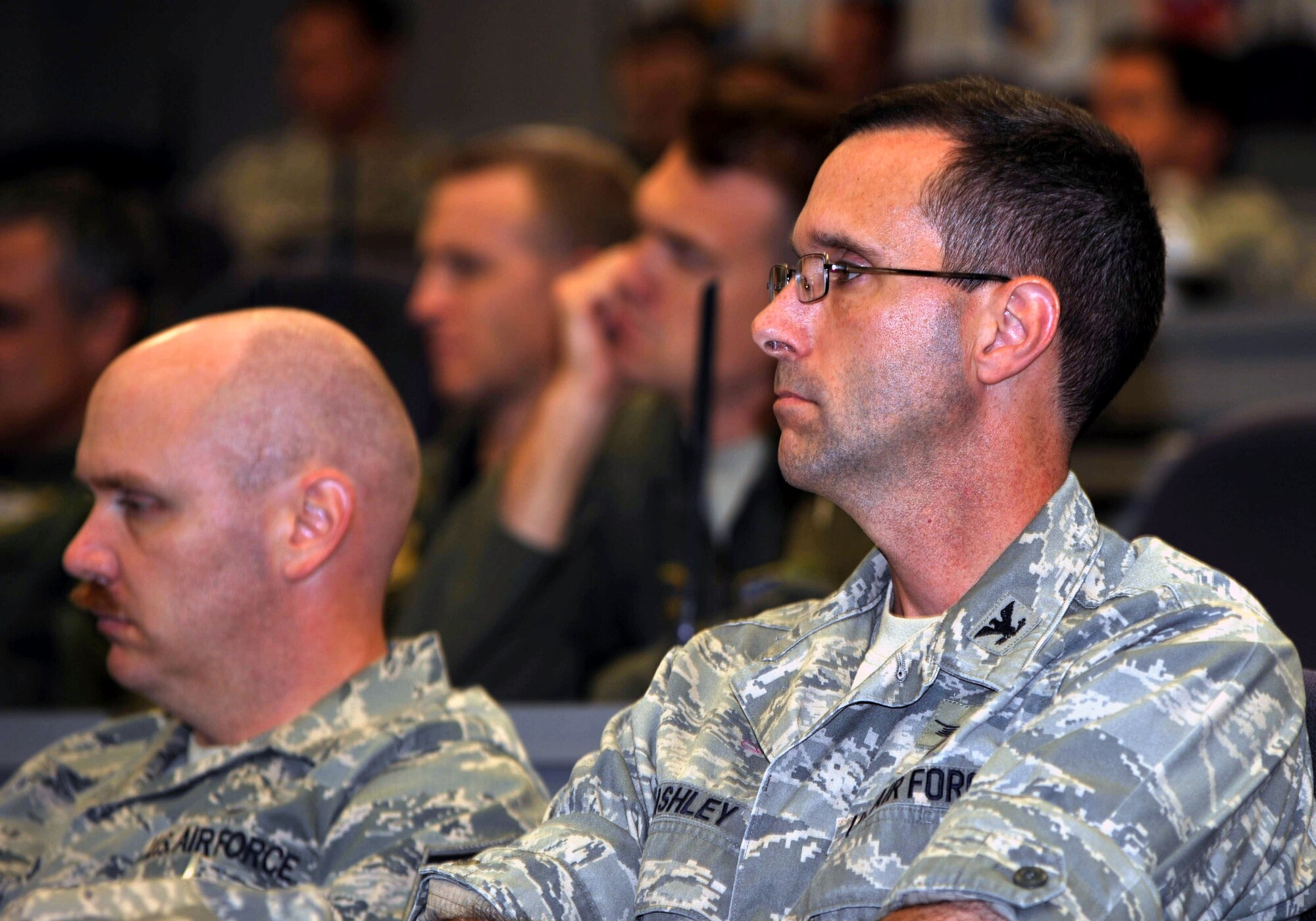 Audience members listen in as veterans of the Vietnam War share their experiences on air refueling from the war as part of the Air Mobility Command Tanker "Living Legends" Speaker Series in the Global Reach Planning Center at Scott Air Force Base, Ill., on Sept. 24, 2009.  (U.S. Air Force Photo/Tech. Sgt. Scott T. Sturkol)