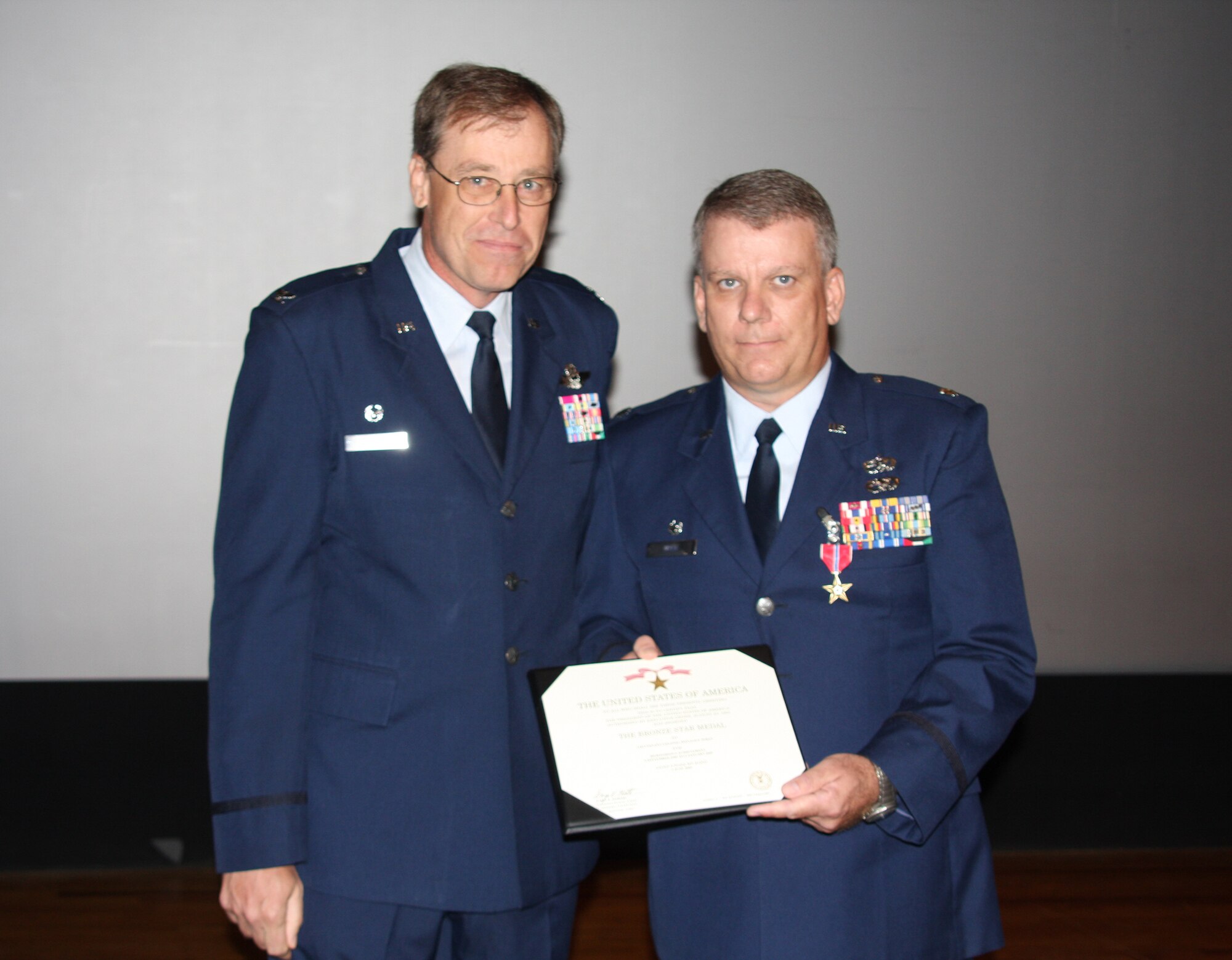 WRIGHT-PATTERSON AIR FORCE BASE, Ohio - Lt. Col. Donald Wren, 445th Logistics Readiness Squadron commander, received the Bronze Star during the Sept. 13 commander’s call from Col. Stephen Goeman, 445th Airlift Wing commander, for his efforts during his deployment to Afghanistan September 2008 to January 2009. 
The Bronze Star is the fourth-highest combat award for the U. S. Armed Forces. (U. S. photo/Tech. Sgt. Jeremy Caskey) 