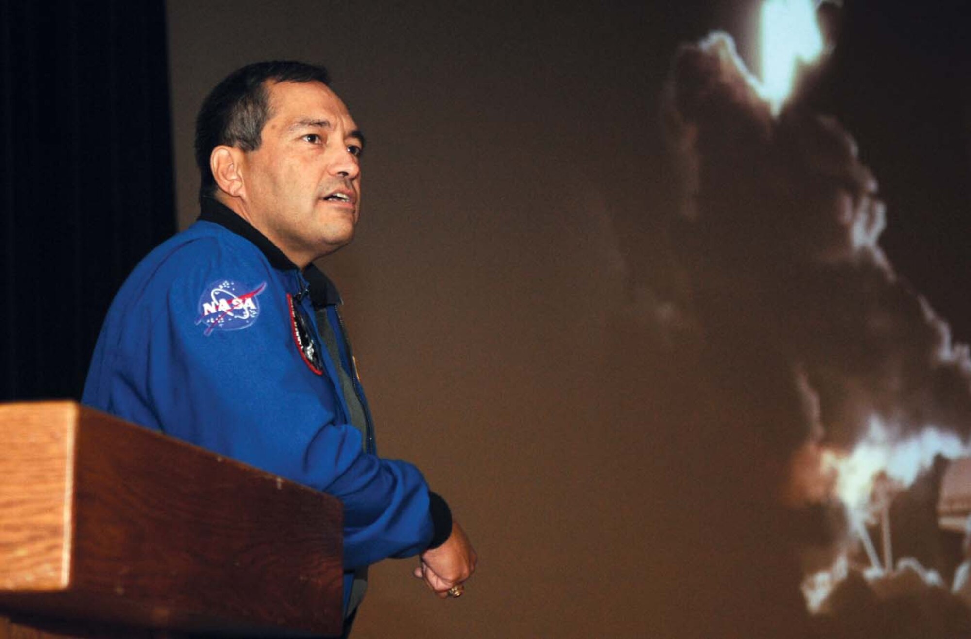 Astronaut Lt. Col. (ret.) Carlos Noriega speaks to Team Andrews members at the base theater Wednesday, as part of the base’s Hispanic Heritage Month activities. Mr. Noriega is a retired U.S. Marine Corps helicopter pilot and veteran of two space shuttle missions with more than 481 hours in space and 19 hours conducting spacewalks. (U.S. Air Force photo/ Senior Airman Steven Doty)