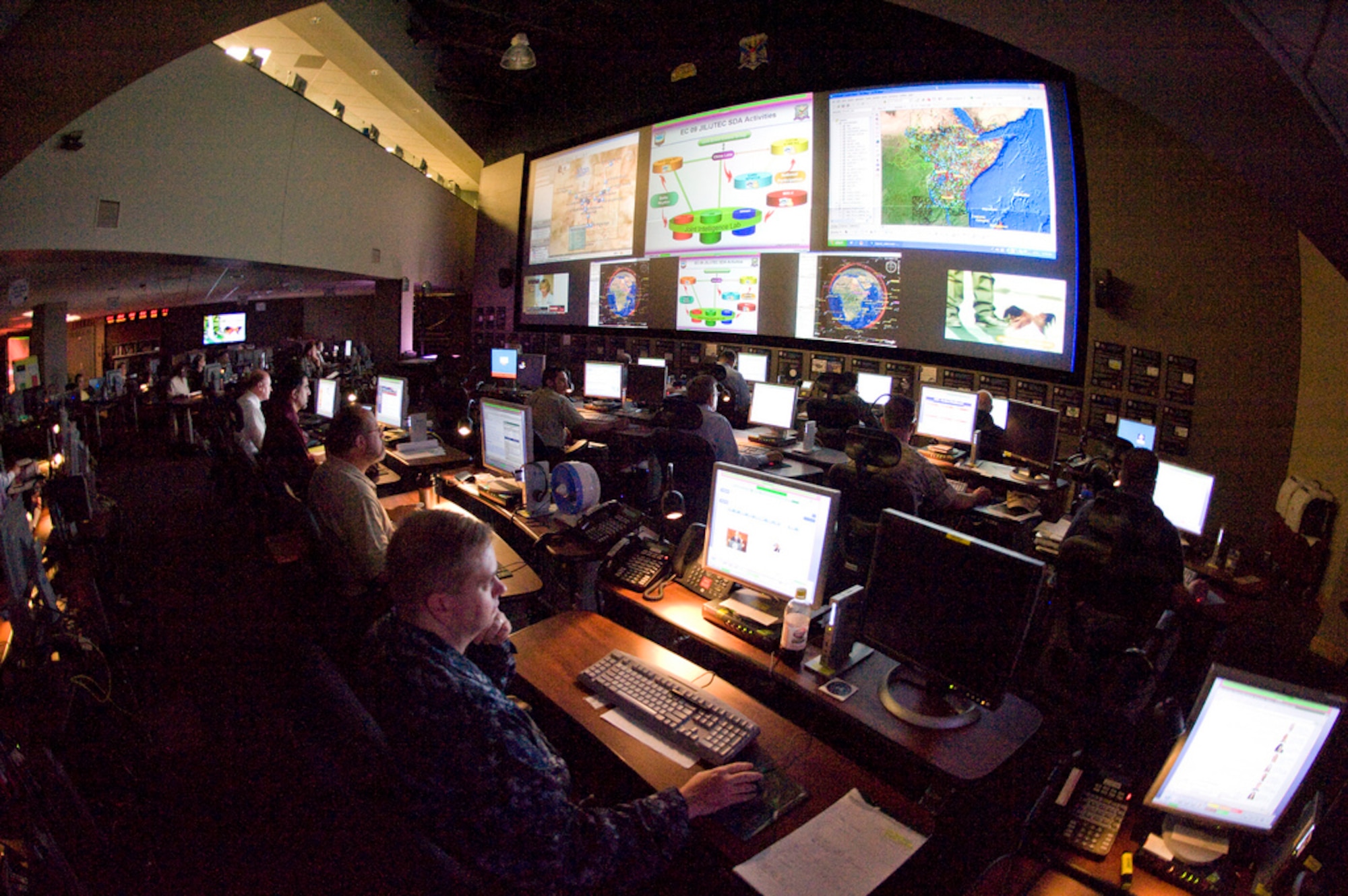 Operators in U.S. Joint Forces Command's Joint Intelligence Laboratory (JIL) work to support Empire Challenge '09 missions this past summer.  EC '09 demonstrated the joint, national and coalition interoperability of the Distributed Common Ground System.  (Courtesy Photo)
