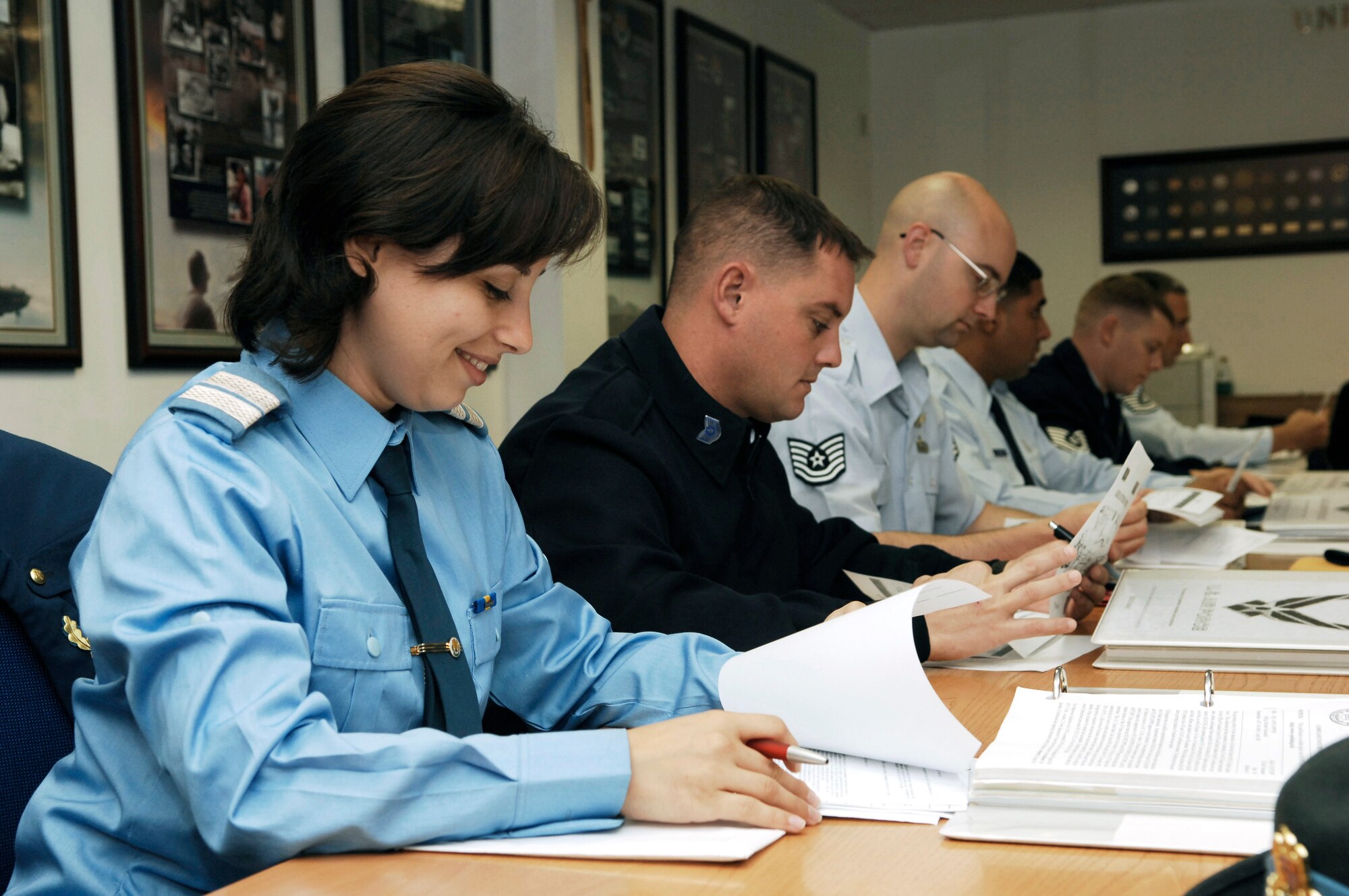 Romanian Air Force Plutonier (Tech. Sgt. Equivalent) Diana-Cristina Mireuta, left, attends classes with her U.S. Air Force peers Monday at the Kisling NCO Academy.  Plutonier Mireuta is the first international student to attend the NCO Academy as part of USAFE’s International Military Education and Training initiative.  (U.S. Air Force Photo by Tech. Sgt. Chenzira Mallory)