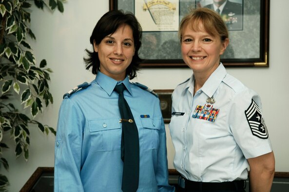 Chief Master Sgt. Pamela Derrow, welcomes Romanian Air Force Plutonier (Tech. Sgt. Equivalent) Diana-Cristina Mireuta to the Kisling Noncommissioned Officer Academy Monday. Plutonier Mireuta is the first Romanian Air Force student to attend the Kisling NCO Academy. (U.S. Air Force Photo by Tech. Sgt. Chenzira Mallory)