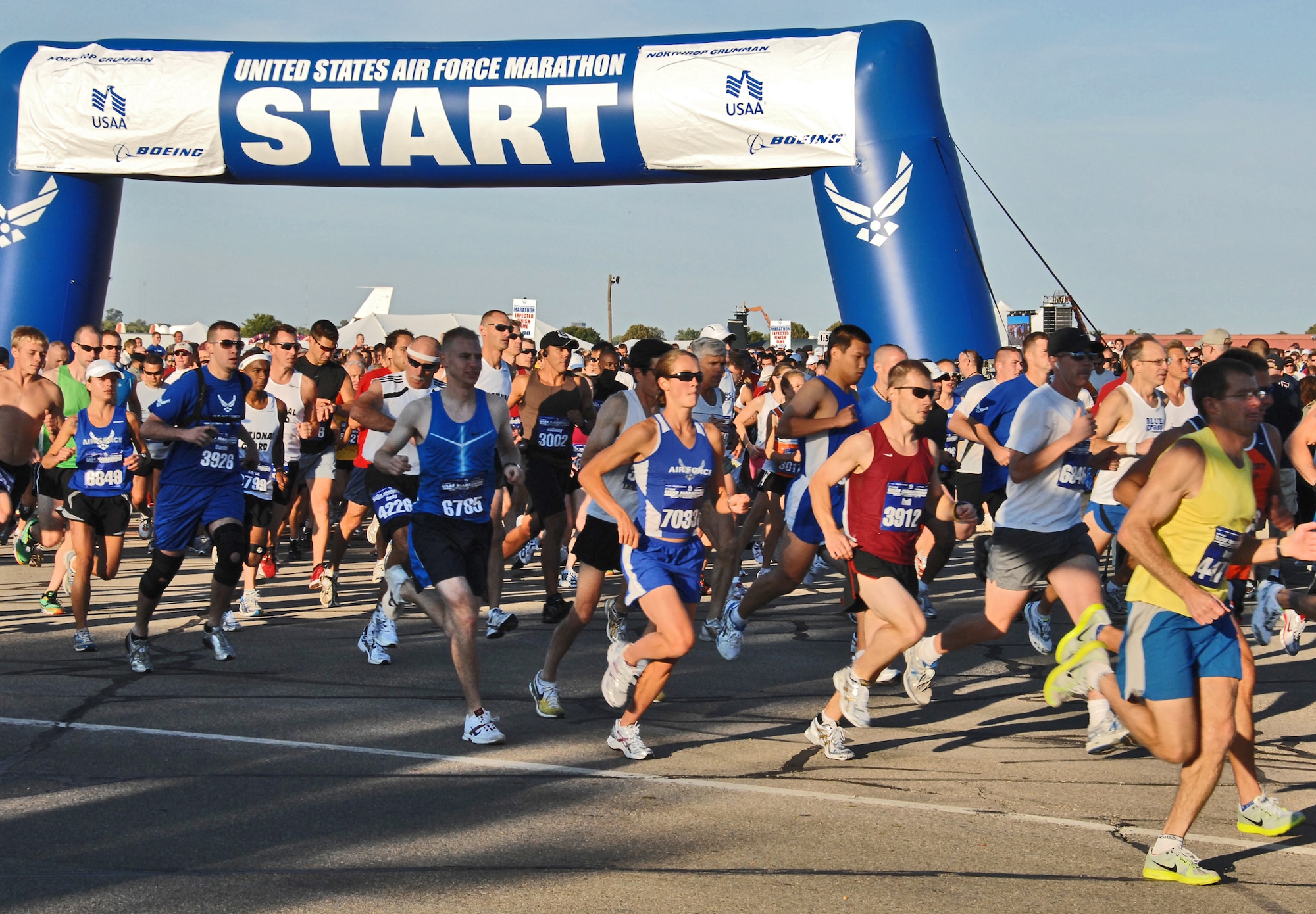 First Lieutenant Caroline White, wearing race bib 7033, joins more than 3,800 runners at the start of the half marathon Sept. 19, 2009 at Wright-Patterson Air Force Base, Ohio. U.S. Air Force Marathon race events attracted nearly 10,000 total runners. White won the half marathon women's division.  She is currently assigned on temporary duty with the Air Force World Class Athlete Program in Colorado Springs, Colo. and is slated to begin pilot training at Sheppard AFB, Texas, later this year.  (Air Force photo/Ben Strasser)