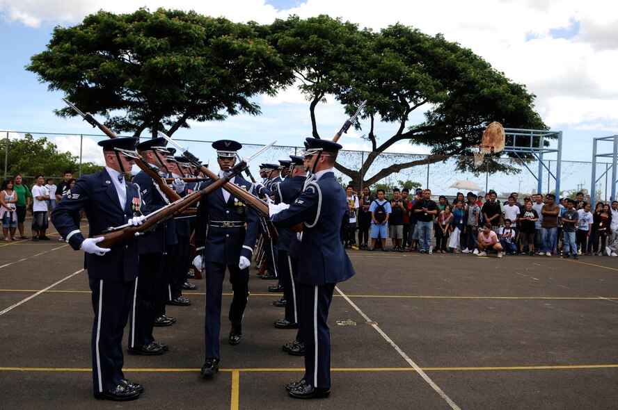Tech. Sgt Robert Jones, Honor Guard Drill Team flight chief, walks the “gauntlet” during a 16-man Drill Team performance Sept. 22 at Waipahu High School in Waipahu, Hawaii. The Drill Team is the traveling component of the U.S. Air Force Honor Guard and tours worldwide representing all Airmen while showcasing Air Force precision and professionalism. (U.S. Air Force photo by Staff Sgt. Dan DeCook)