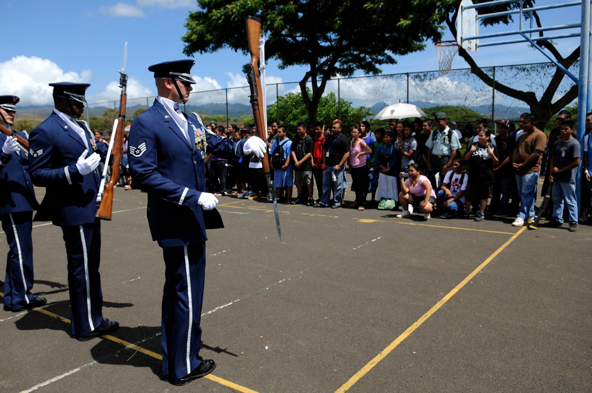 Members of the U.S. Air Force Honor Guard Drill Team perform for students at Waipahu High School Sept. 22 in Waipahu, Hawaii. The Drill Team is the traveling component of the U.S. Air Force Honor Guard and tours worldwide representing all Airmen while showcasing Air Force precision and professionalism. (U.S. Air Force photo by Staff Sgt. Dan DeCook)