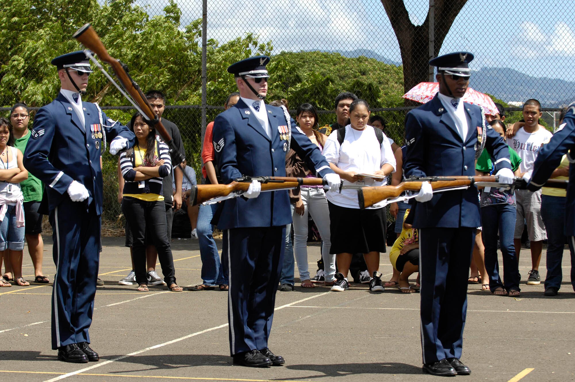 Members of the U.S. Air Force Honor Guard Drill Team perform for students at Wai’anae High School Sept. 22 in Wai’anae, Hawaii. The Drill Team is the traveling component of the U.S. Air Force Honor Guard and tours worldwide representing all Airmen while showcasing Air Force precision and professionalism. (U.S. Air Force photo by Staff Sgt. Dan DeCook)