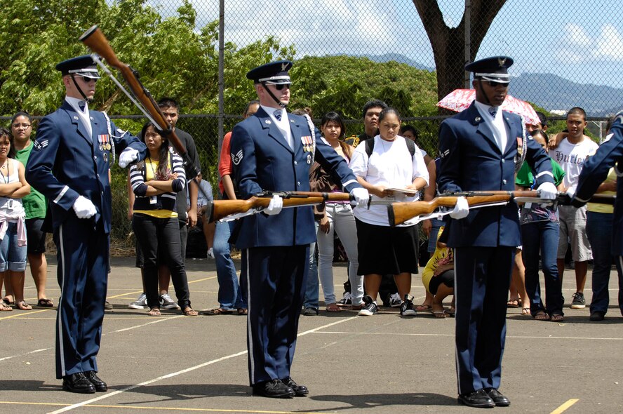 Members of the U.S. Air Force Honor Guard Drill Team perform for students at Wai’anae High School Sept. 22 in Wai’anae, Hawaii. The Drill Team is the traveling component of the U.S. Air Force Honor Guard and tours worldwide representing all Airmen while showcasing Air Force precision and professionalism. (U.S. Air Force photo by Staff Sgt. Dan DeCook)