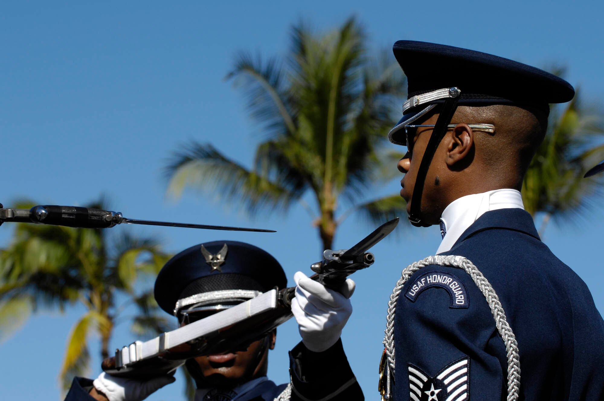 Tech. Sgt Robert Jones, Honor Guard Drill Team flight chief, performs with the four-man team during a 16-man Drill Team performance Sept. 22 at Wai’anae High School in Wai’anae, Hawaii. The Drill Team is the traveling component of the U.S. Air Force Honor Guard and tours worldwide representing all Airmen while showcasing Air Force precision and professionalism. (U.S. Air Force photo by Staff Sgt. Dan DeCook)