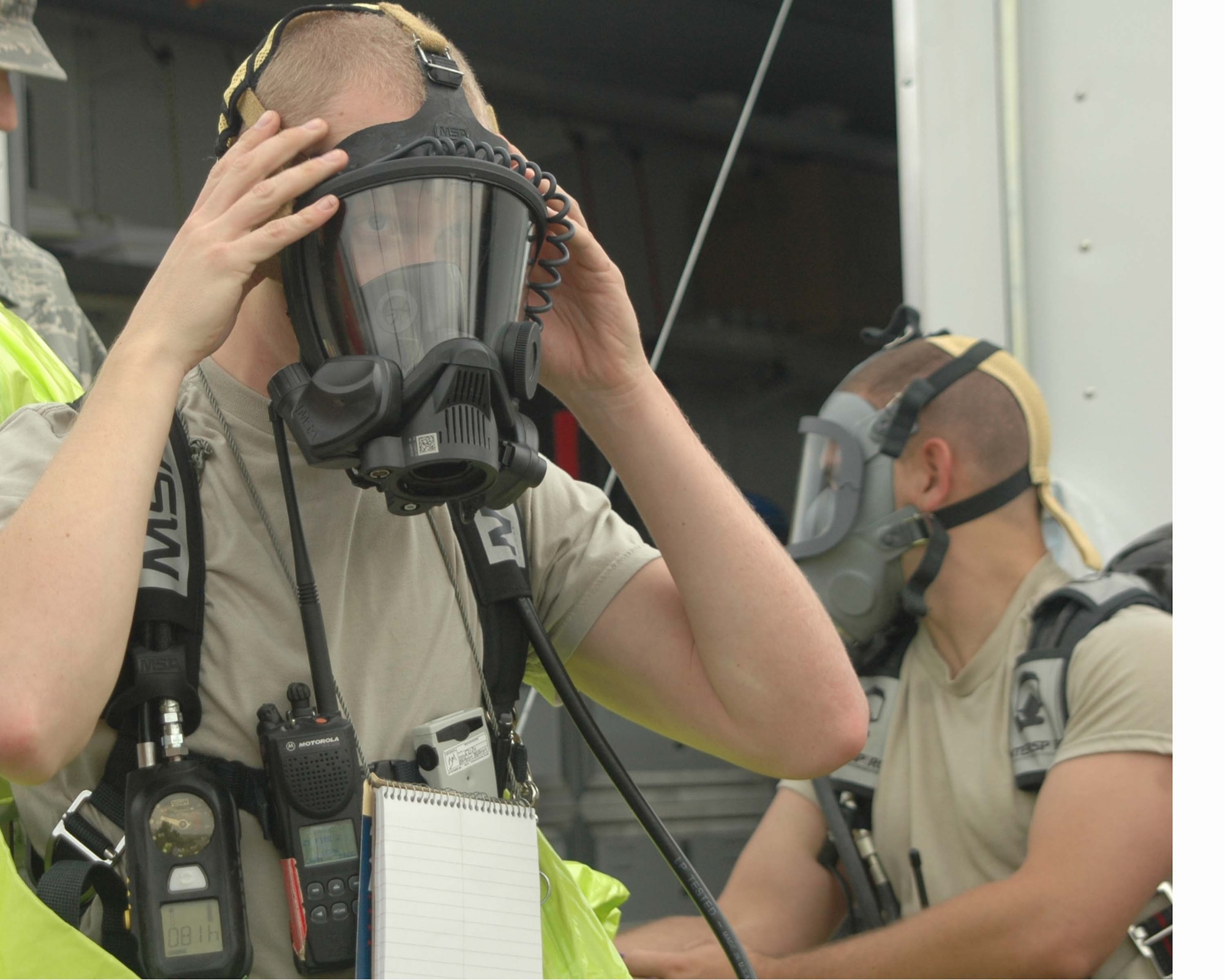 ALTUS AIR FORCE BASE, Okla.—Senior Airman Adam Hills, 97th Civil Engineer Squadron, suits up in a Level A suit to assess the containment of chemical run off that may be present at a crash site during the Major Accident Response Exercise Sept. 15. The MARE is part of the job performance inspections that are evaluated during the Unit Compliance Inspection. Altus received an overall rating of “excellent”. (U.S. Air Force photo/Senior Airman Leandra D. Hernandez)