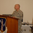 Senior Master Sgt. Tim Campbell, 174FW MQ-9 Maintenance Field Training Detachment Superintendent addresses the assembled audience on the 24th of September prior to the first graduating class of the Ground Control Station maintenance course held here at Hancock Field Air National Guard Base. (U. S. Air Force photo by Staff Sgt. Barbara Olney/RELEASED)
