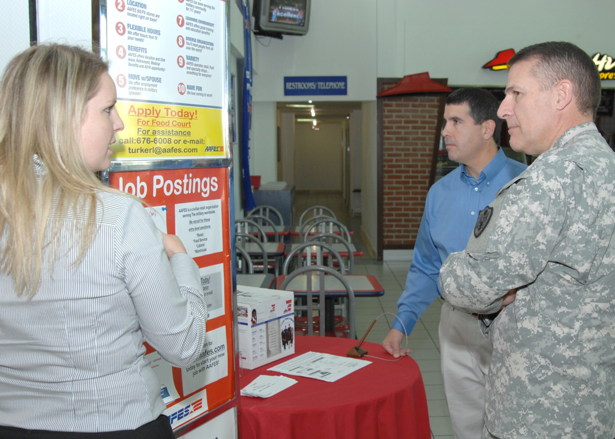 Page Clark, Incirlik Base Exchange store manager,  explains the current job postings to Maj. Gen. Keith Thurgood, Army and Air Force Exchange Service commander, along with Tony Ventura, Base Exchange general manager Wednesday,  September 23, 2009 at Incirlik Air Base, Turkey.   General Thurgood’s visited Incirlik to meet the AAFES staff, learn base specific procedures and offer advice.  (U.S. Air Force photo/Staff Sgt. Lauren Padden)
