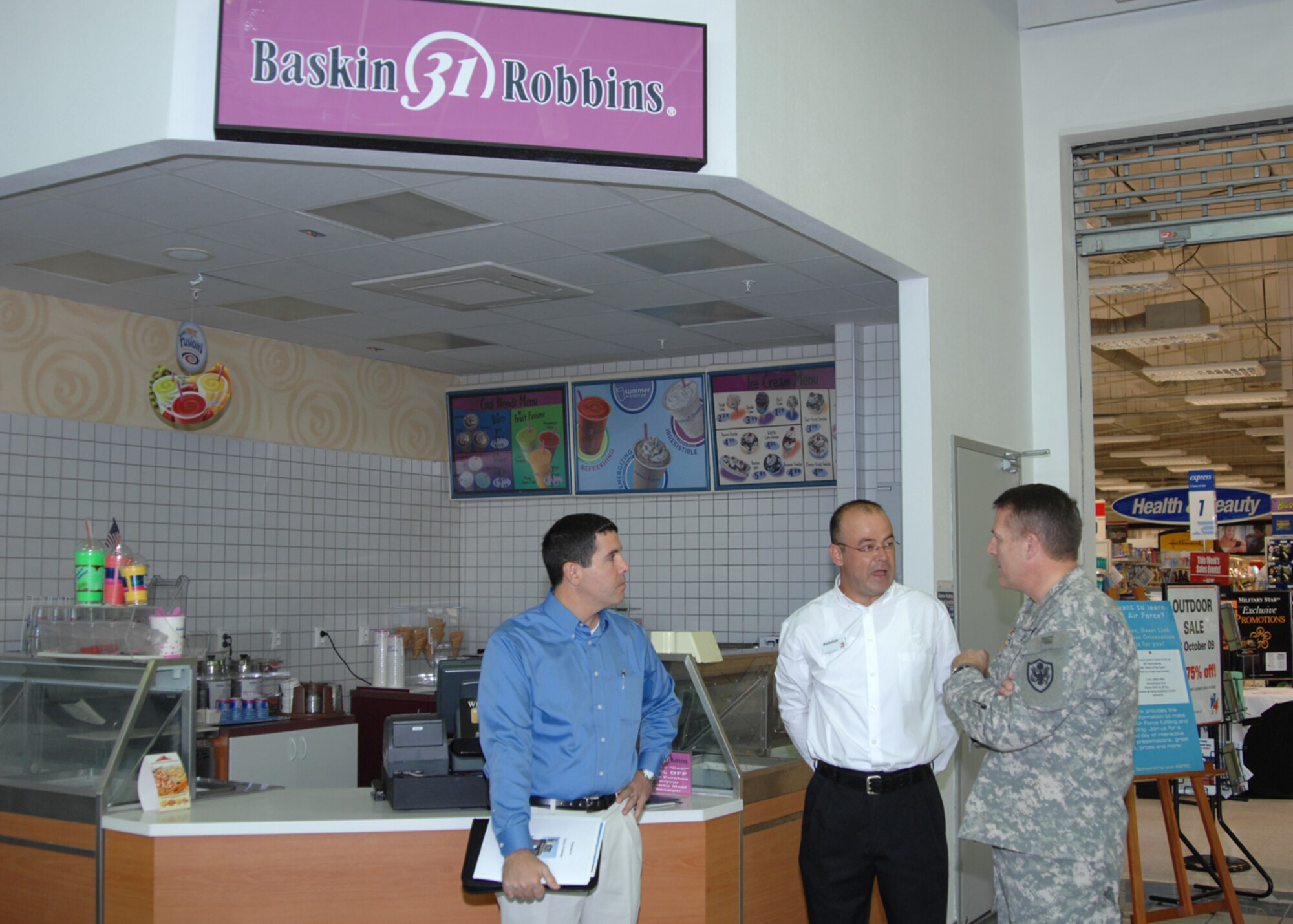 Abdullah Cevik, food court manager, explains local procedures and operations of the Incirlik Food Court to Maj. Gen. Keith Thurgood, commander, Army and Air Force Exchange Service, with base exchange general manager Tony Ventura, Wednesday, September 23, 2009 Incirlik Air Base, Turkey.  General Thurgood’s visited Incirlik to meet the AAFES staff, learn base specific procedures and offer advice.  (U.S. Air Force photo/Staff Sgt. Lauren Padden)
