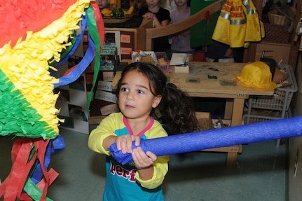Camryn Cumming gets ready to hit the Pinata during the Hispanic Heritage Month-Pinata Party held at the Randolph Child Development Center on September 24, 2009. (U.S. Air Force photo by Don Lindsey)