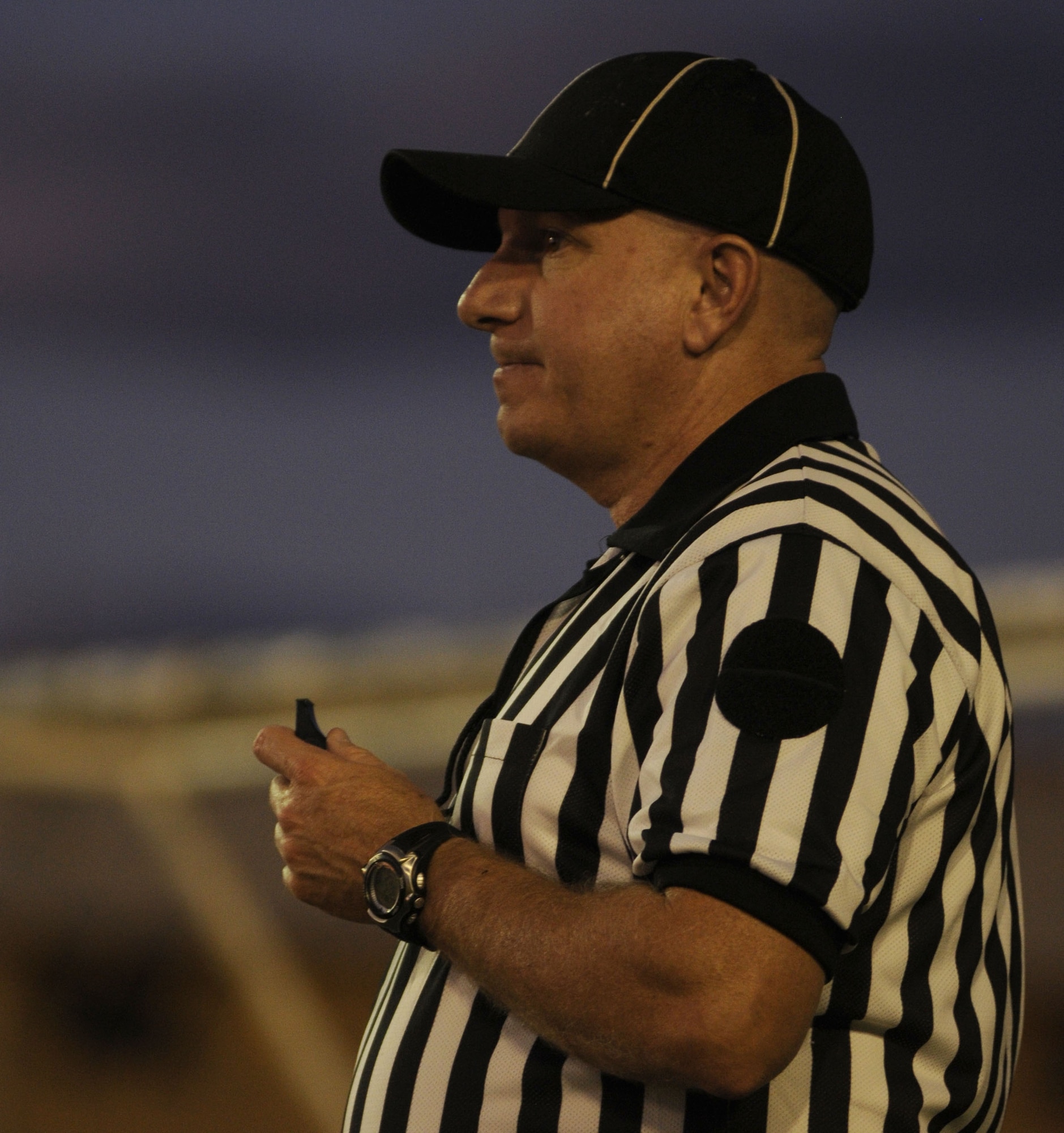 Tech. Sgt. Joe Lancaster, 39th Force Support Squadron, waits to throw a flag as he referees Wednesday, Sept. 23, 2009, during an intramural flag football game at Incirlik Air Base, Turkey. There are eight squadrons competing in this year’s season with seven scheduled games before the playoffs. (U.S. Air Force photo/Airman 1st Class Amber Ashcraft)