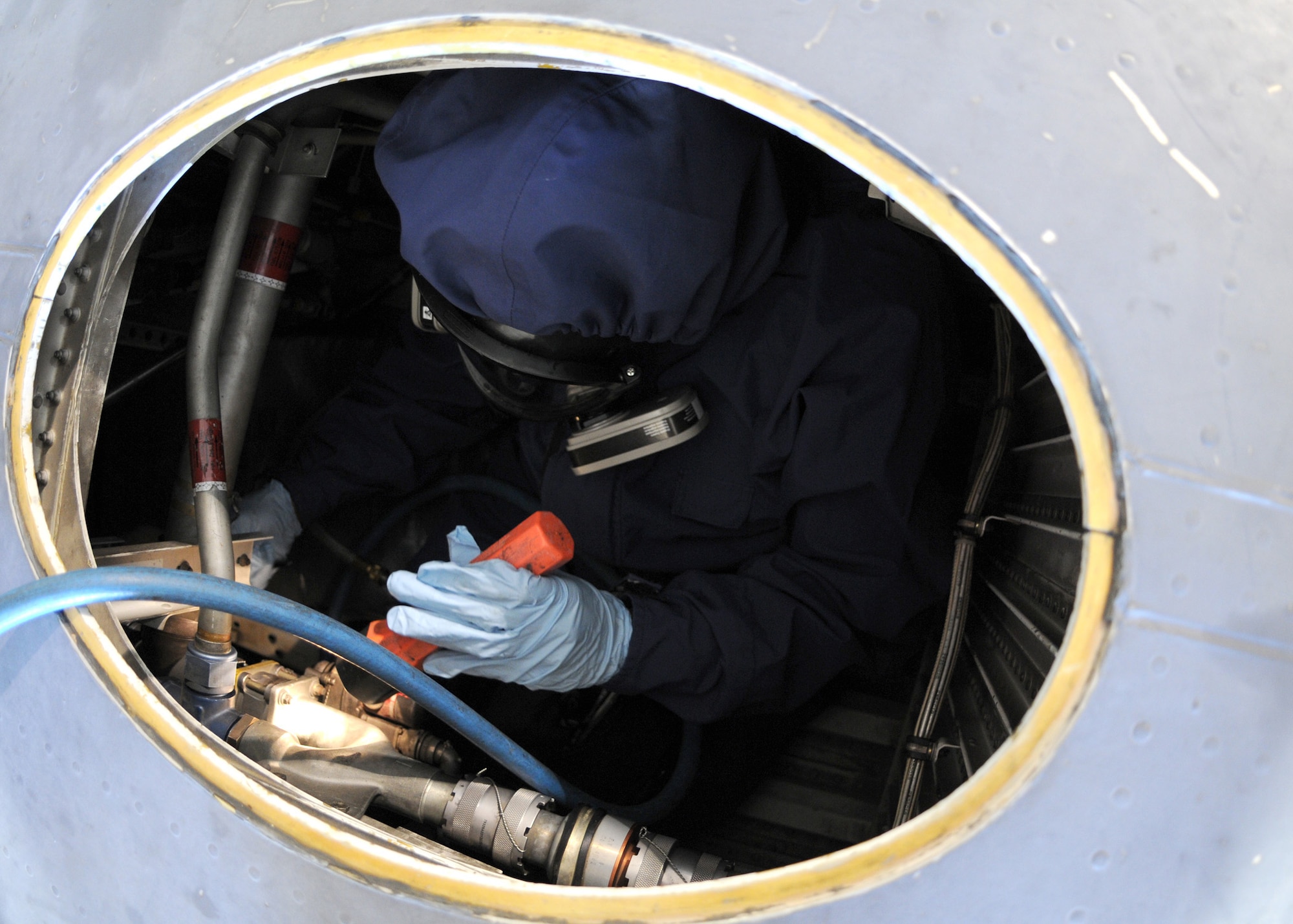 RAF MILDENHALL, England – Airman 1st Class Tracy Banks, 100th Maintenance Squadron fuels system repair apprentice performs a foreign object damage inspection inside the wing of a C-130 Sept. 24. The purpose of the inspection is to ensure all fuel areas and system components are serviceable so they are able to provide a safe, reliable, mission-ready aircraft. (U.S. Air Force photo/ Staff Sgt. Jerry Fleshman)