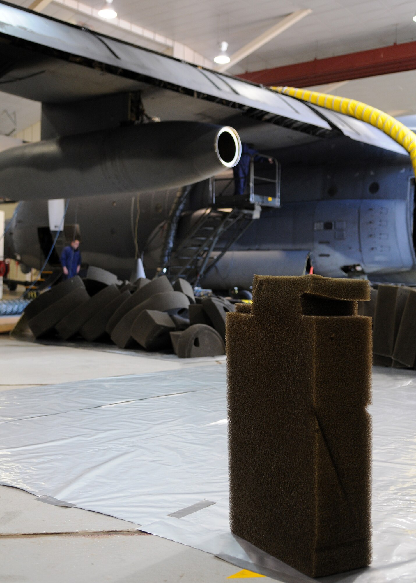 RAF MILDENHALL, England – Airmen from the 100th Maintenance Squadron fuel shop, remove hundreds of fire suppressant foam pieces from a C-130 during a foreign object damage inspection Sept. 24. In an event of a fire the foam pieces prevent fire from spreading through the aircraft. (U.S. Air Force photo/ Staff Sgt. Jerry Fleshman)