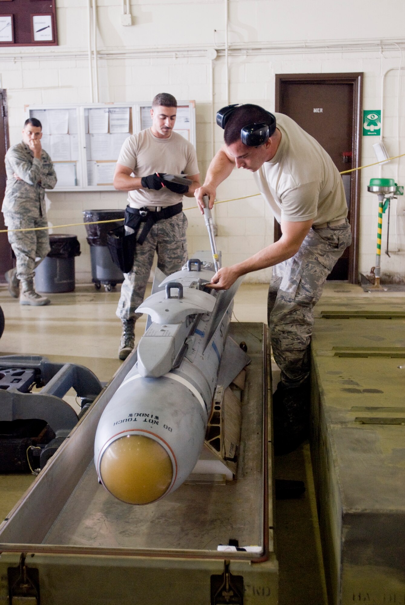 KUNSAN AIR BASE, Republic of Korea -- Staff Sgt. Darren Wittmann and Airman 1st Class Nathan Brown, 35th Aircraft Maintenance Unit, prepares an AGM-65D Maverick to be loaded on an F-16 Fighting Falcon during the Kunsan's monthly weapons load competition Sept. 25. The 389th Aircraft Maintenance Unit won over the 35th Aircraft Maintenance Unit and 80th Maintenance Unit. (U.S. Air Force photo/ Senior Airman Jonathan Steffen)